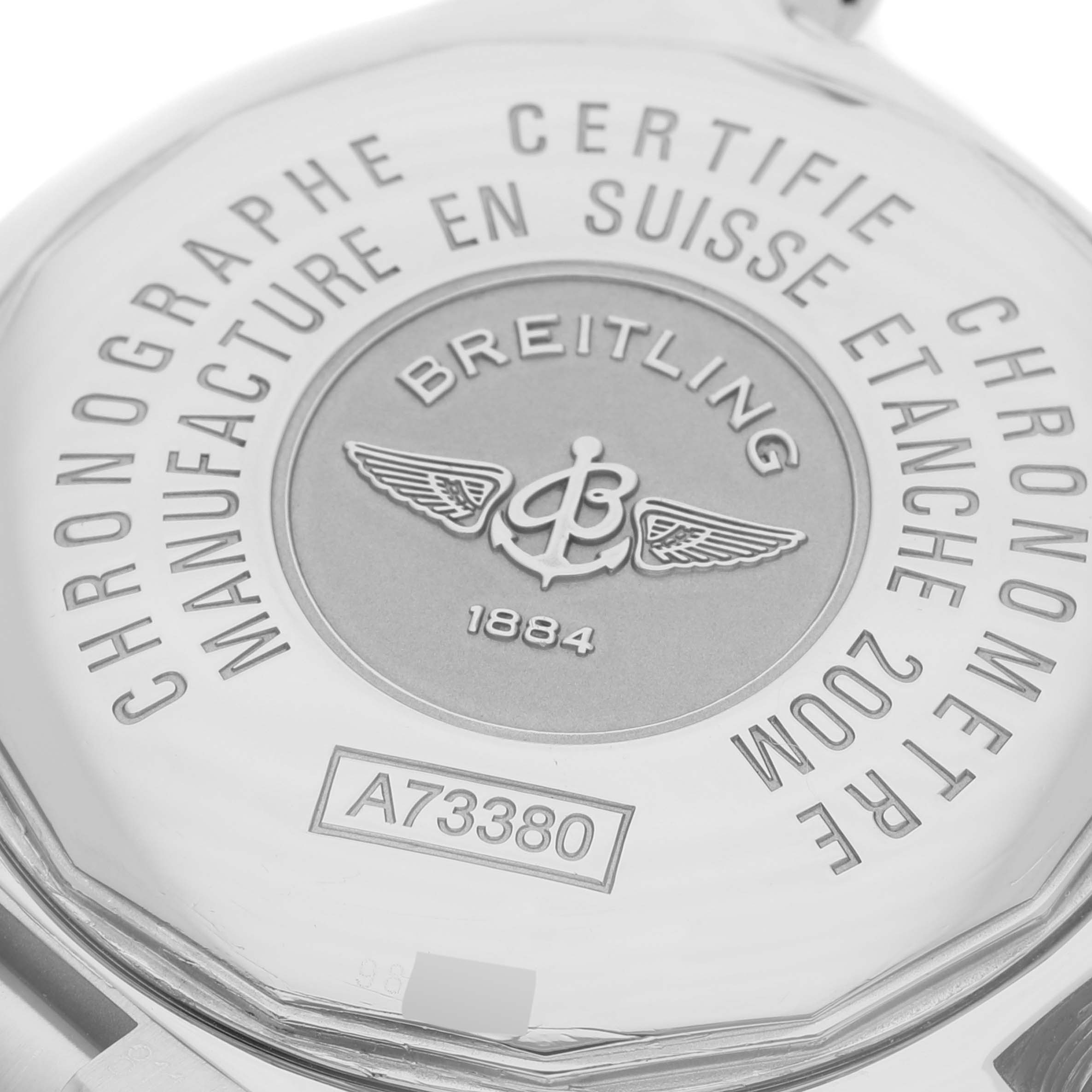 The image shows the back case of a Breitling Colt A73380 Men's Stainless Steel Blue Dial A73380 Men's Stainless Steel Blue Dial watch, highlighting its certifications and model number A73380.