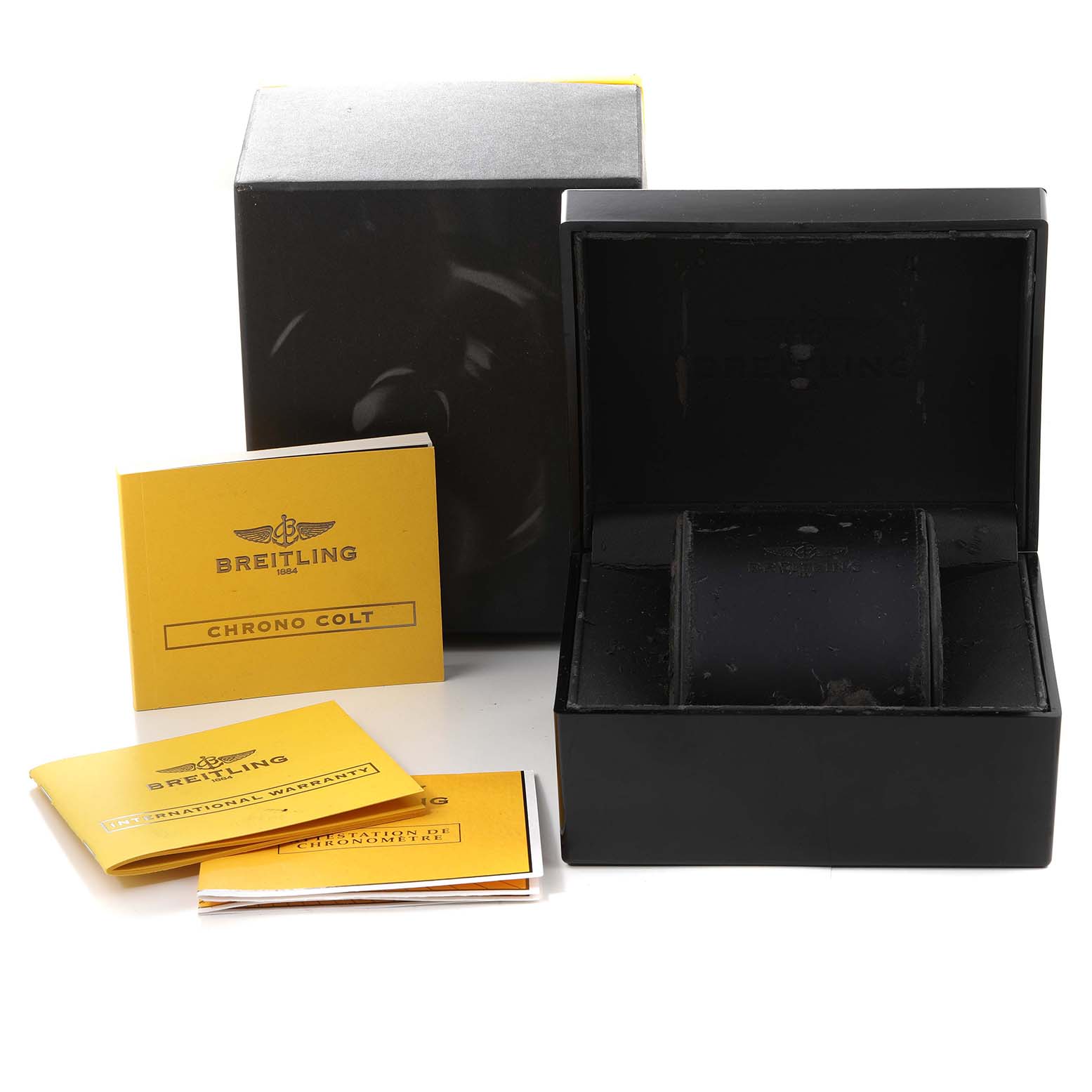 This image shows the packaging and booklets of a Breitling Colt A73380 Men's Stainless Steel Blue Dial A73380 Men's Stainless Steel Blue Dial watch, including the box and instruction manuals.