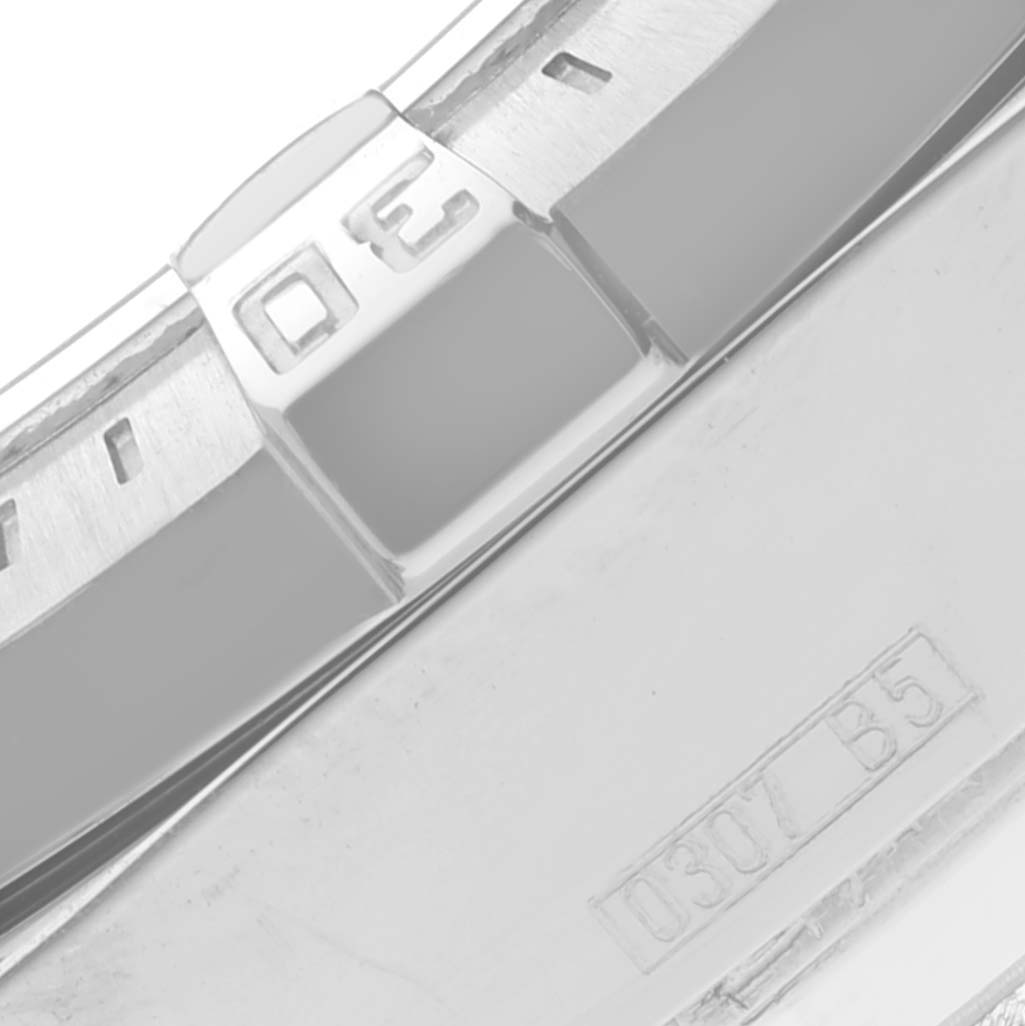 This image shows a close-up of the bezel and part of the case back of a Breitling Colt A73380 Men's Stainless Steel Blue Dial A73380 Men's Stainless Steel Blue Dial watch.