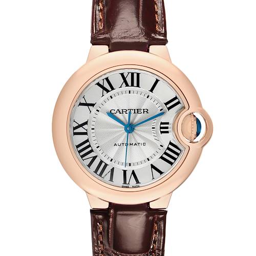 The Cartier Ballon Bleu W6920097 Women's Rose Gold Silver Dial watch is shown from a front angle, highlighting the dial, Roman numerals, blue sword-shaped hands, and leather strap.