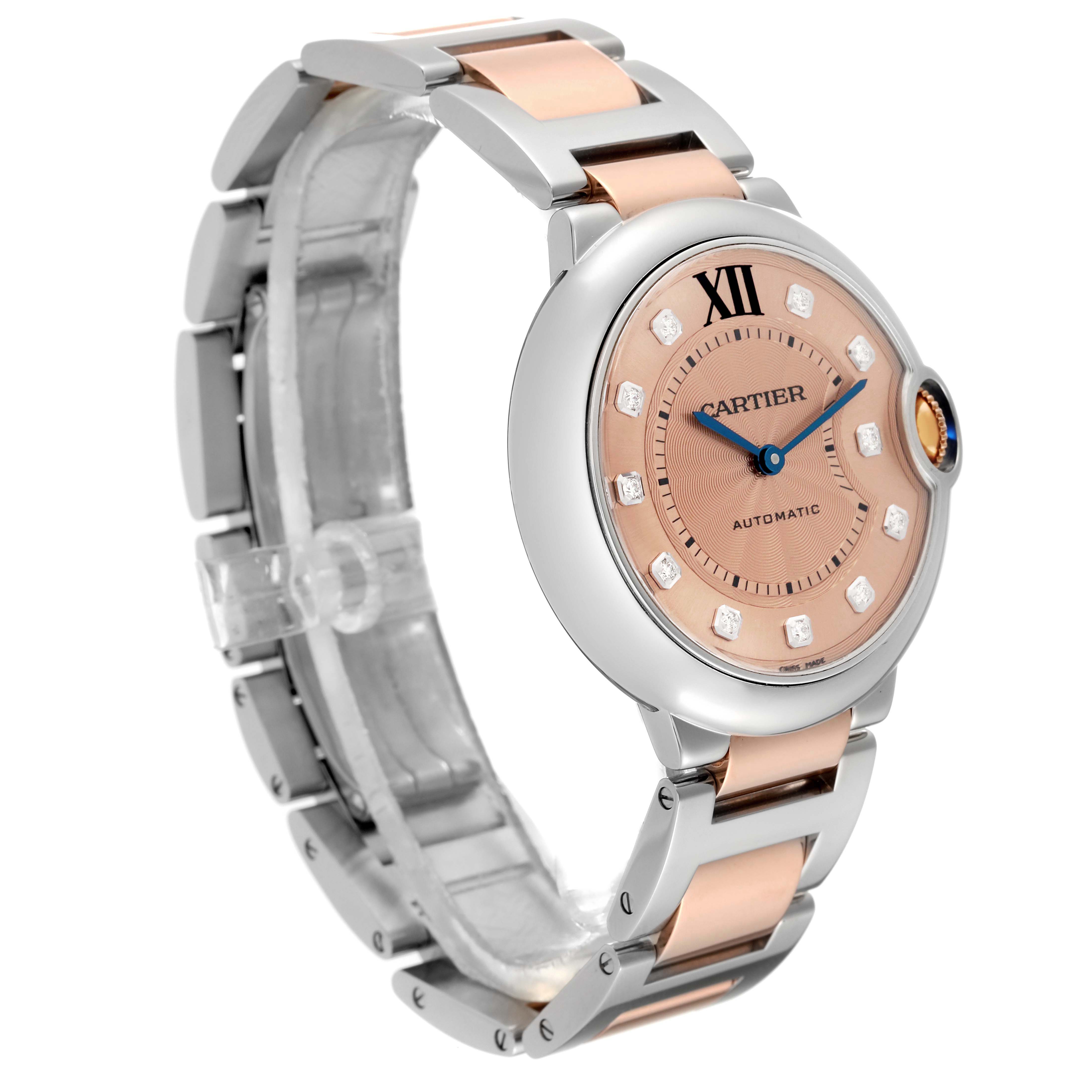 The image shows a Cartier Ballon Bleu WE902054 Women's Steel and Gold (two tone) Pink Dial WE902054 Women's Steel and Gold (two tone) Pink Dial model watch from a front-left angle, highlighting its dial and bracelet.