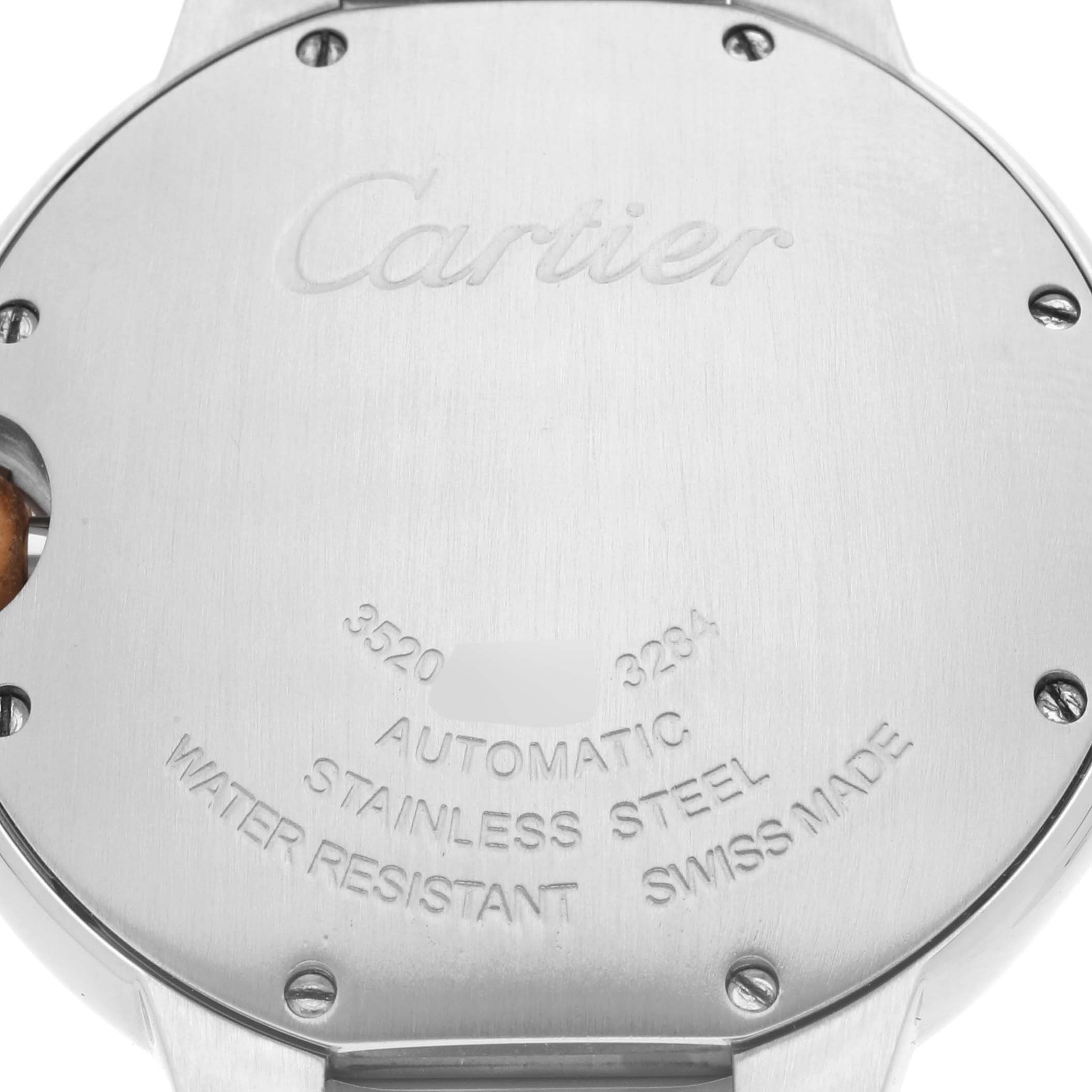 This image shows the stainless steel back case of a Ballon Bleu model by Cartier, featuring engravings and screws.