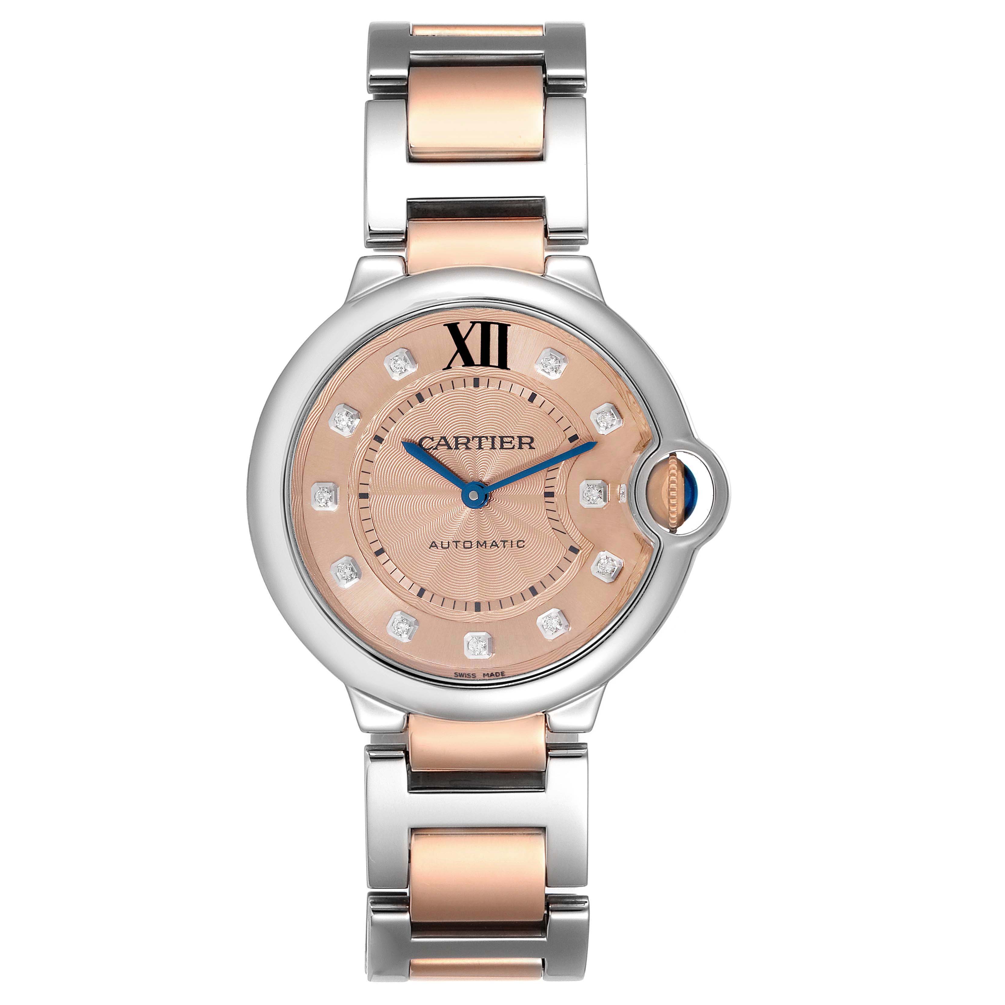 This image shows a front view of a Cartier Ballon Bleu WE902054 Women's Steel and Gold (two tone) Pink Dial WE902054 Women's Steel and Gold (two tone) Pink Dial watch with a two-tone bracelet and a prominent round case.