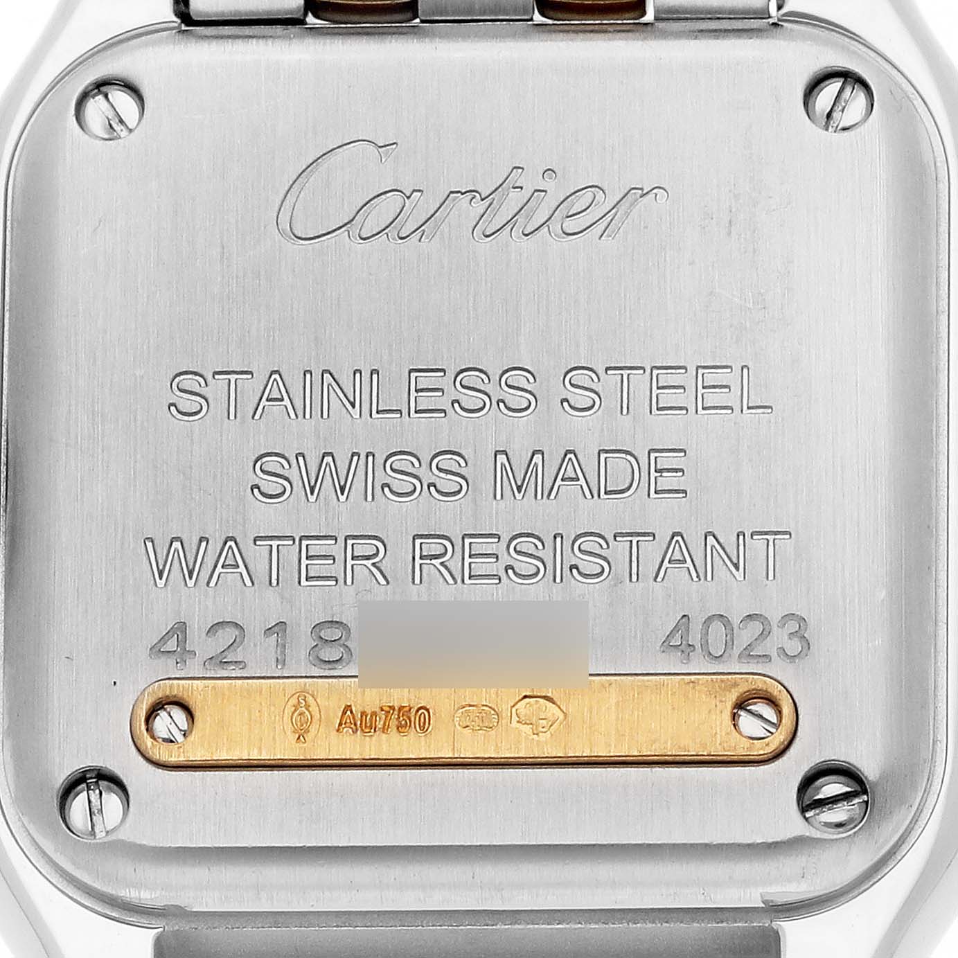 This image shows the case back of a Cartier Panthere W2PN0006 Women's Steel and Gold (two tone) Silver Dial W2PN0006 Women's Steel and Gold (two tone) Silver Dial watch, featuring engraved details and serial numbers.