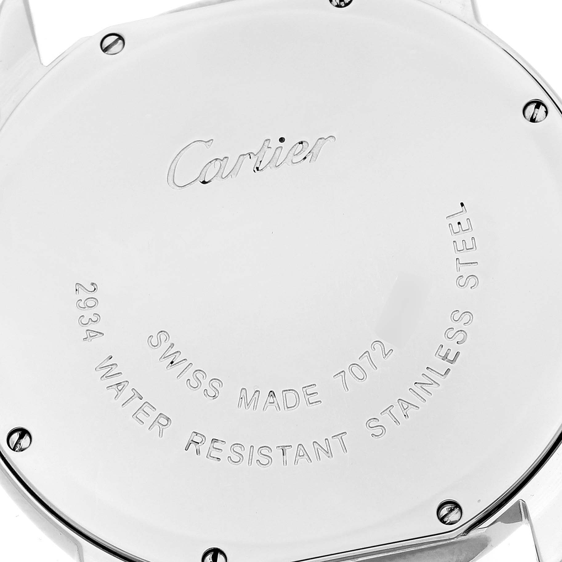 The image shows the back case of a Cartier Ronde W6701005 Men
s Stainless Steel Silver Dial W6701005 Men
s Stainless Steel Silver Dial watch, featuring engraved text and screws.