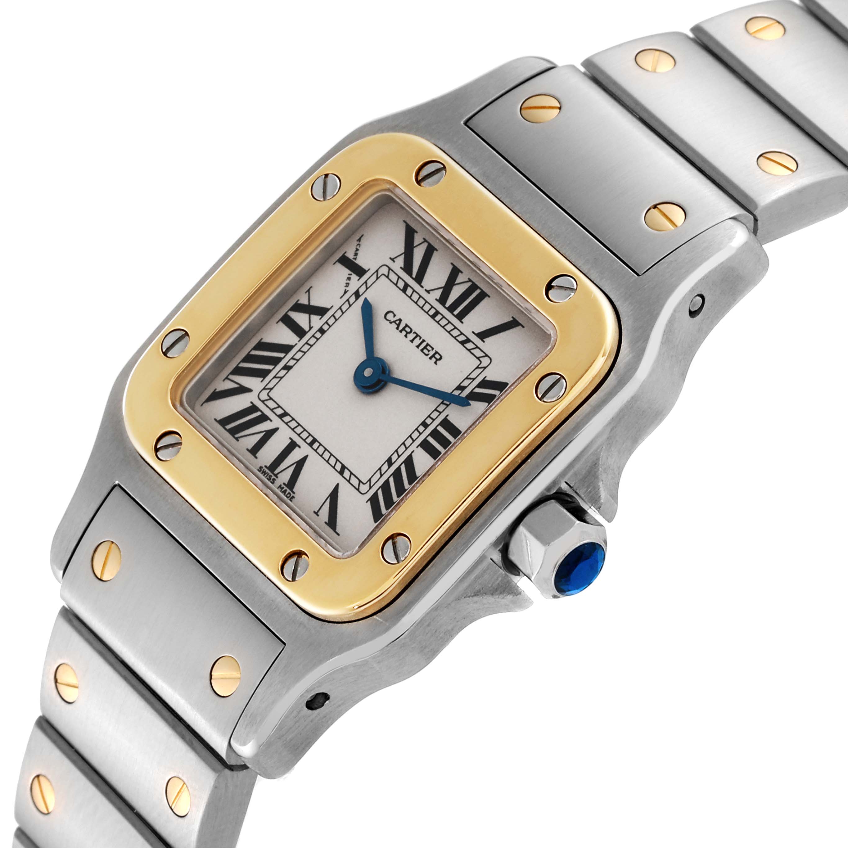 This Cartier Santos W20012C4 Women's Steel and Gold (two tone) Silver Dial W20012C4 Women's Steel and Gold (two tone) Silver Dial watch is shown from an angled view, highlighting the face, bezel, crown, and part of the bracelet.