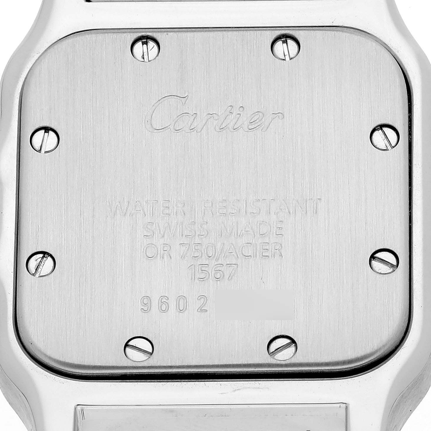 This image shows the back case of a Santos model watch by Cartier with various inscriptions and screws.