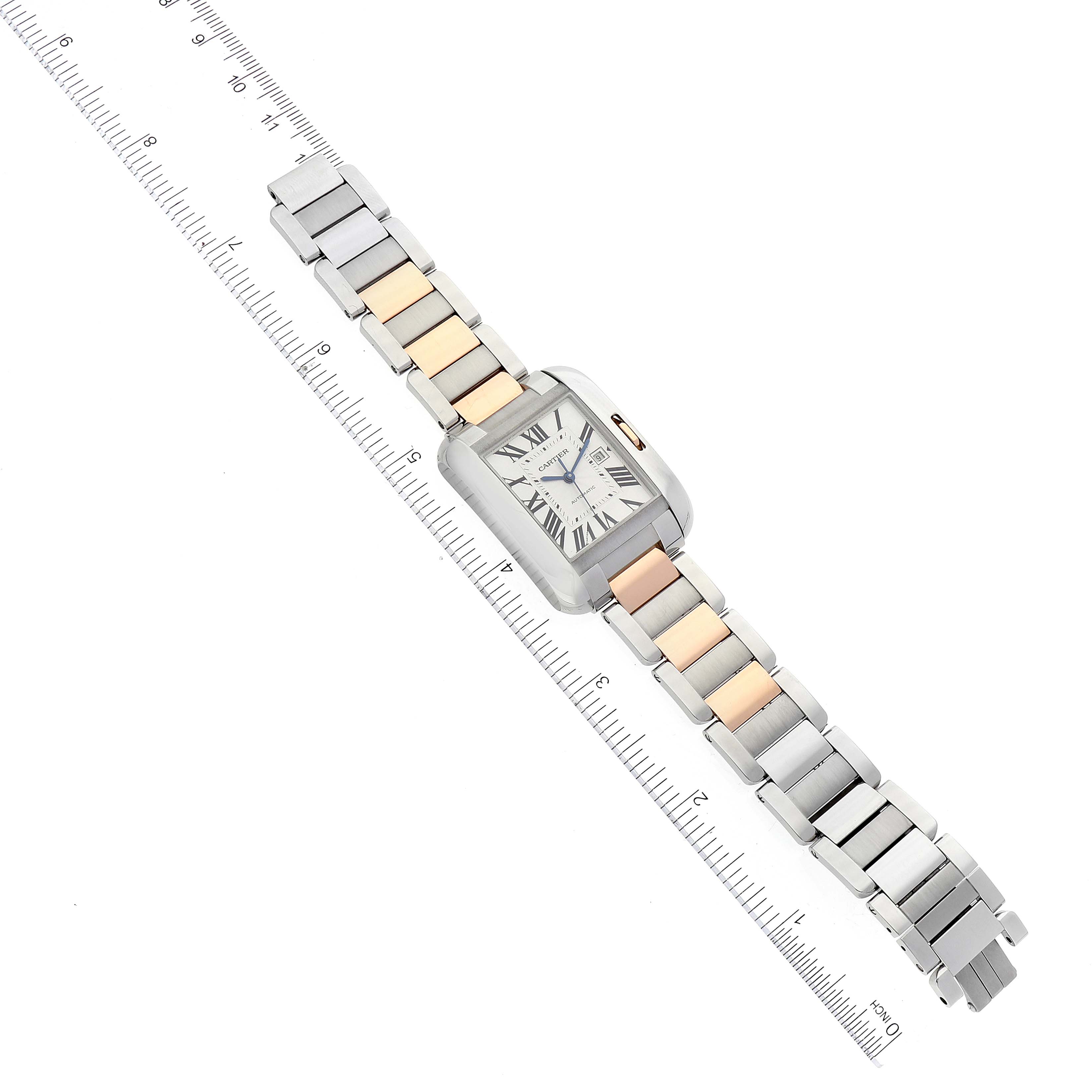 The image shows a top-down view of the Cartier Tank Anglaise W5310007 Men's Steel and Gold (two tone) Silver Dial W5310007 Men's Steel and Gold (two tone) Silver Dial watch, illustrating its face and two-tone metal band alongside a ruler for scale.