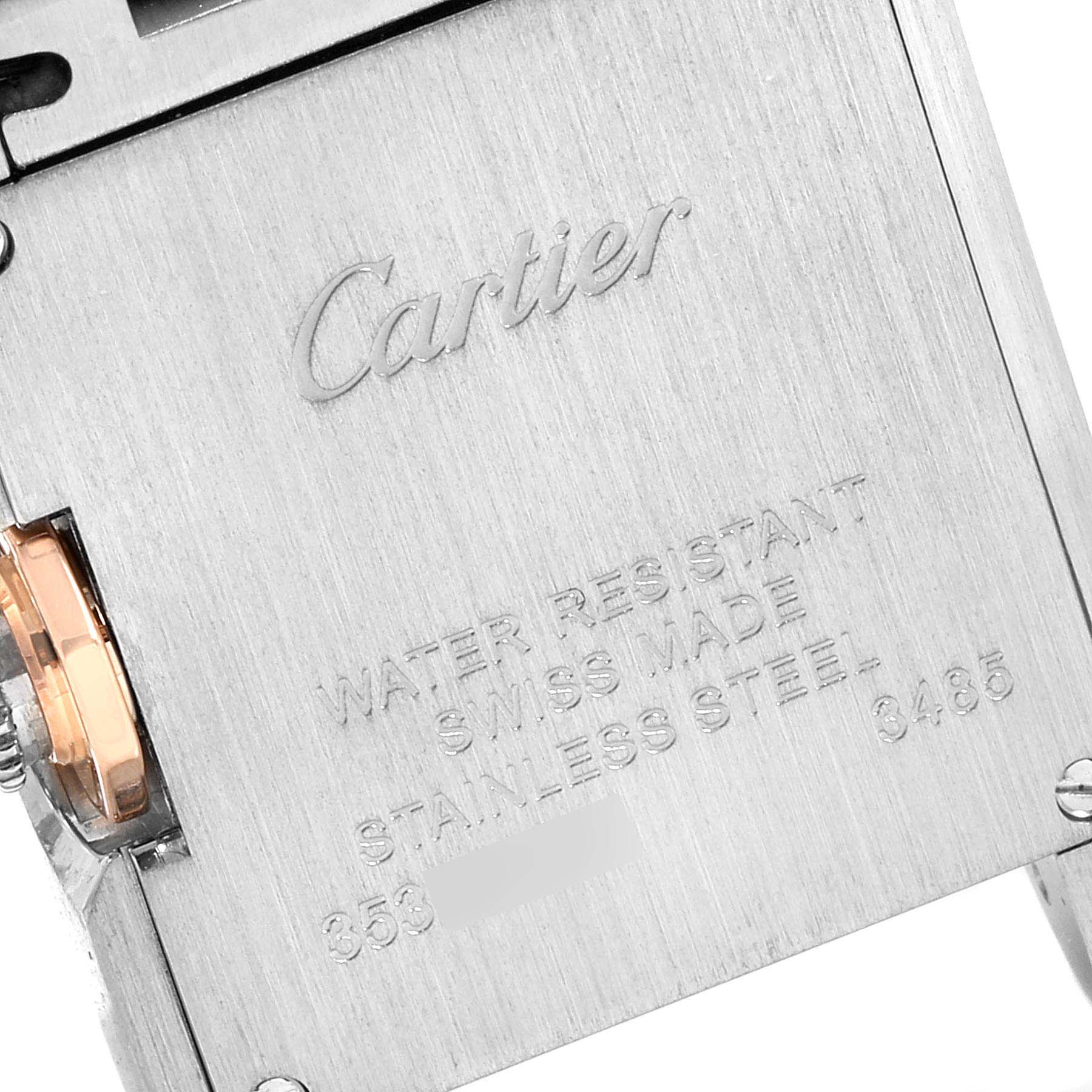 The image shows the back case of a Cartier Tank Anglaise WT100024 Women's Steel and Gold (two tone) Silver Dial WT100024 Women's Steel and Gold (two tone) Silver Dial watch at a close-up angle with engravings visible.