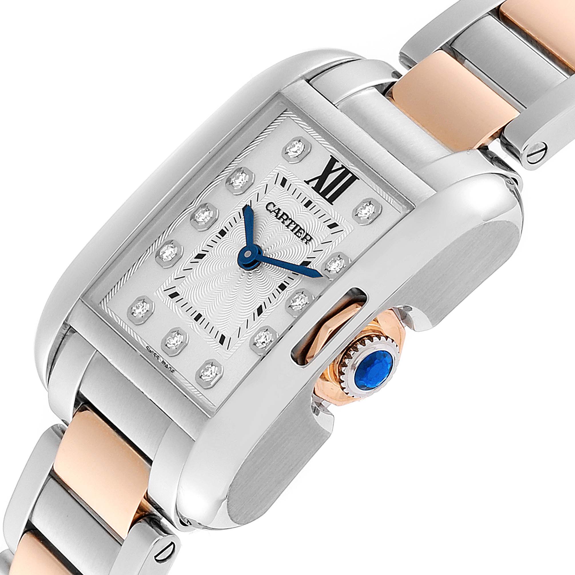 This image displays a close-up of the Cartier Tank Anglaise WT100024 Women's Steel and Gold (two tone) Silver Dial WT100024 Women's Steel and Gold (two tone) Silver Dial watch, highlighting the face, crown with a blue cabochon, and a portion of the bracelet.