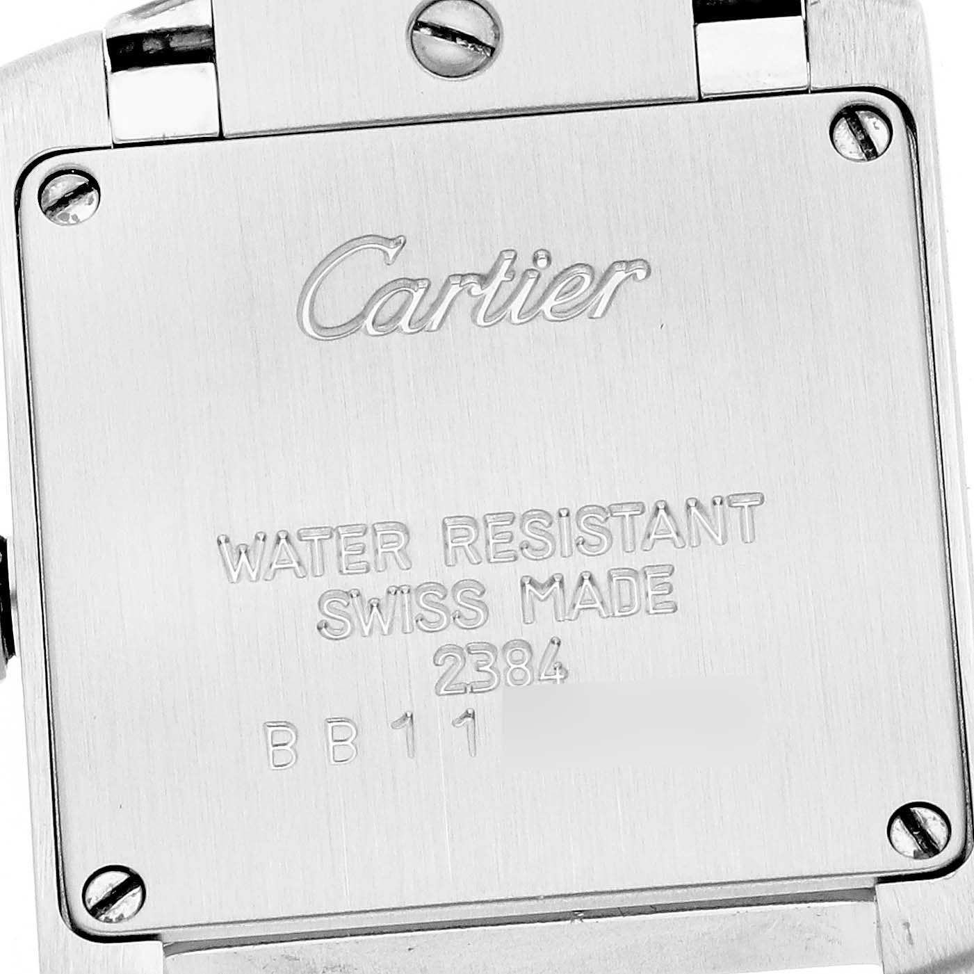 The image shows the back case of a Cartier Tank Francaise W51008Q3 Women's Stainless Steel Silver Dial W51008Q3 Women's Stainless Steel Silver Dial watch at a slight angle, highlighting its inscriptions and screws.