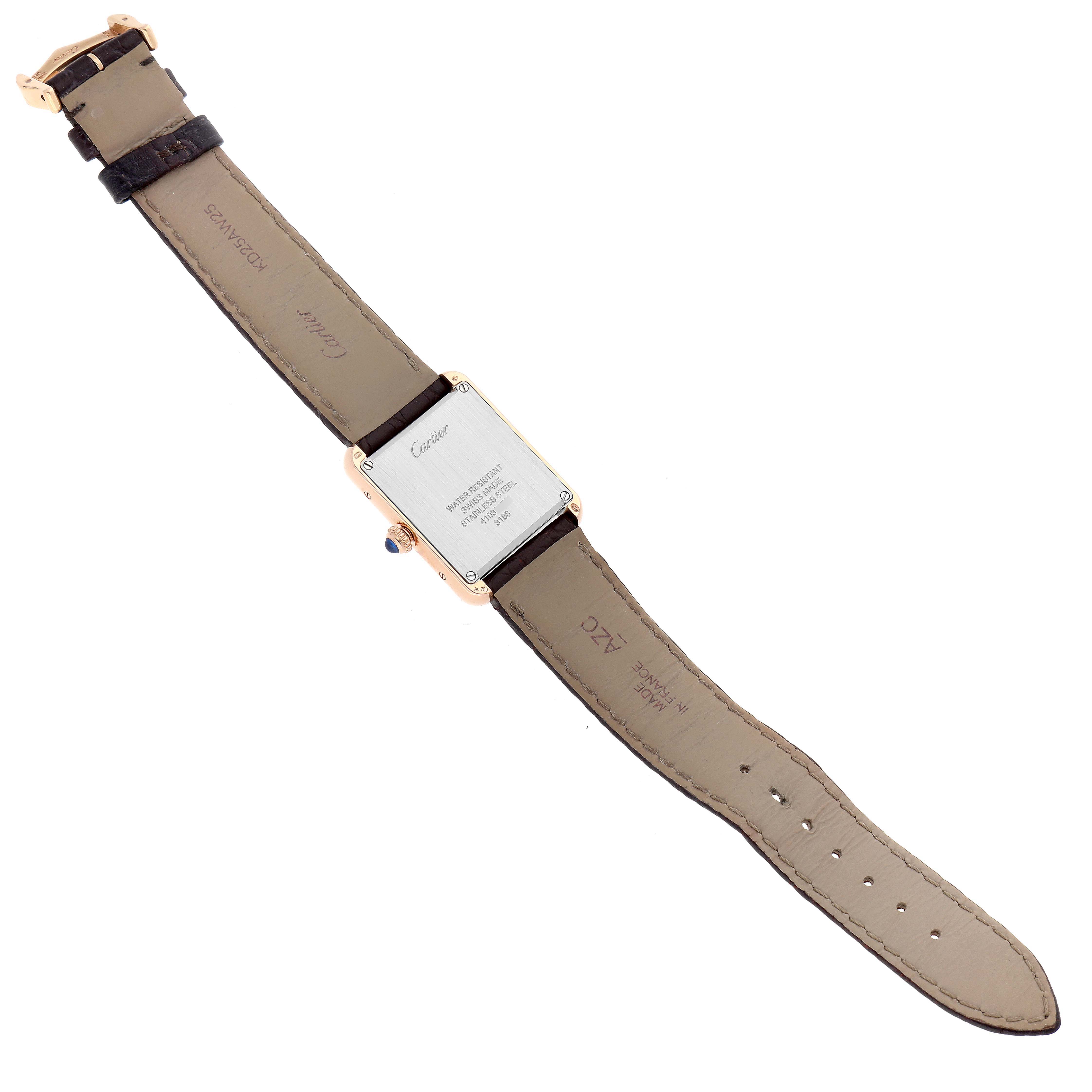 The Cartier Tank Solo W5200002 Women
s Steel and Gold (two tone) Silver Dial watch is shown from the back, highlighting the case back and leather strap.