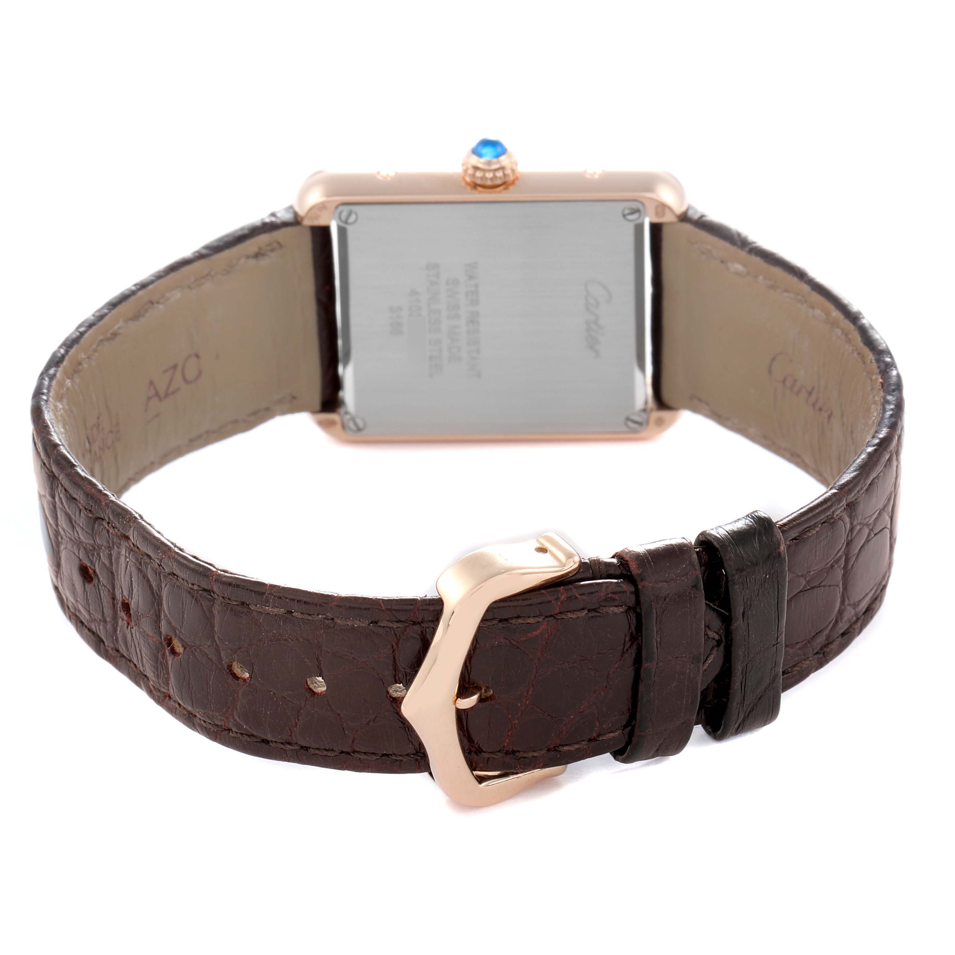 The Cartier Tank Solo W5200002 Women
s Steel and Gold (two tone) Silver Dial watch is shown from the back, displaying the case back, crown, and leather strap with buckle.