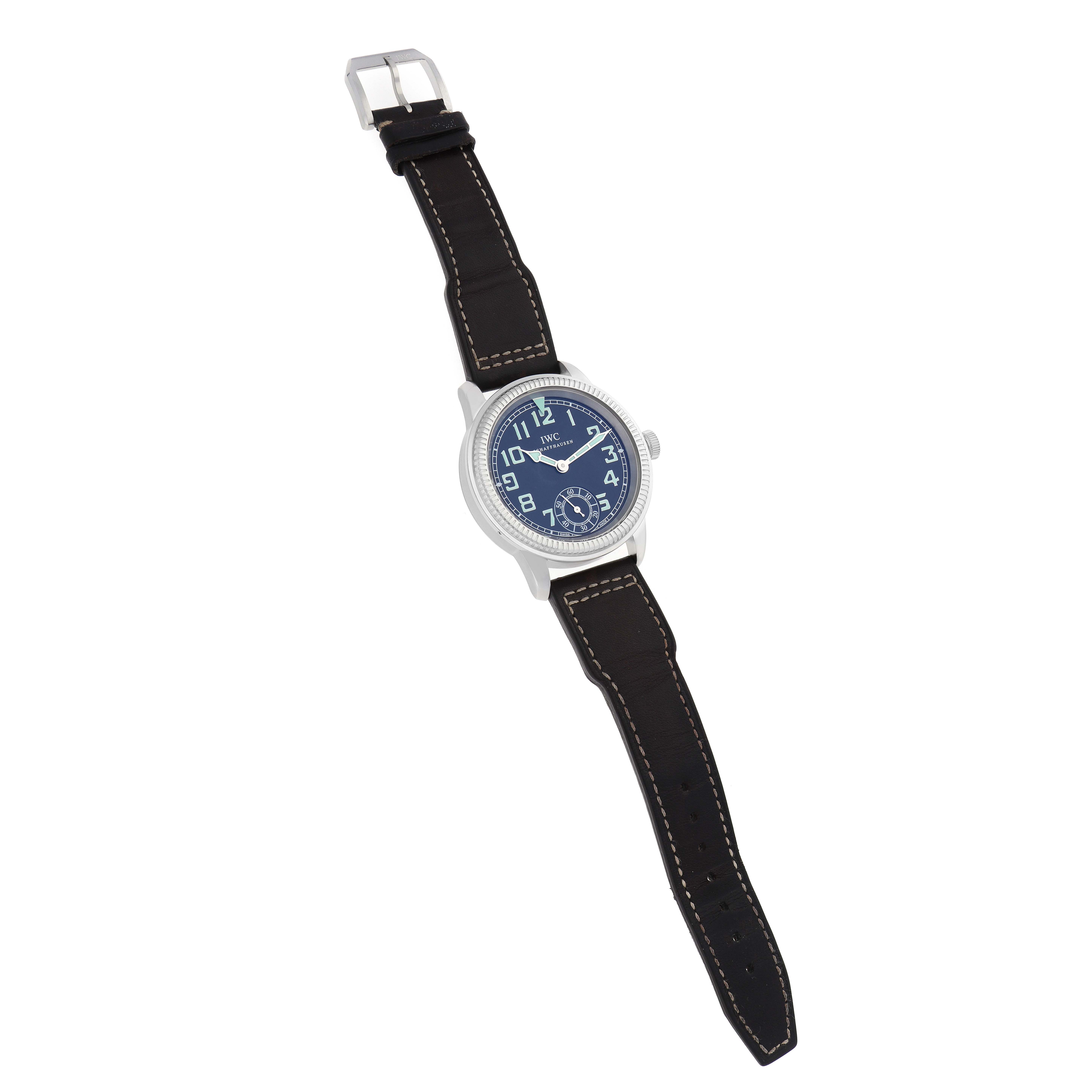 The IWC Pilot IW325401 Men
s Platinum Black Dial model watch is shown from a top-down angle, displaying the face, case, and full leather strap.