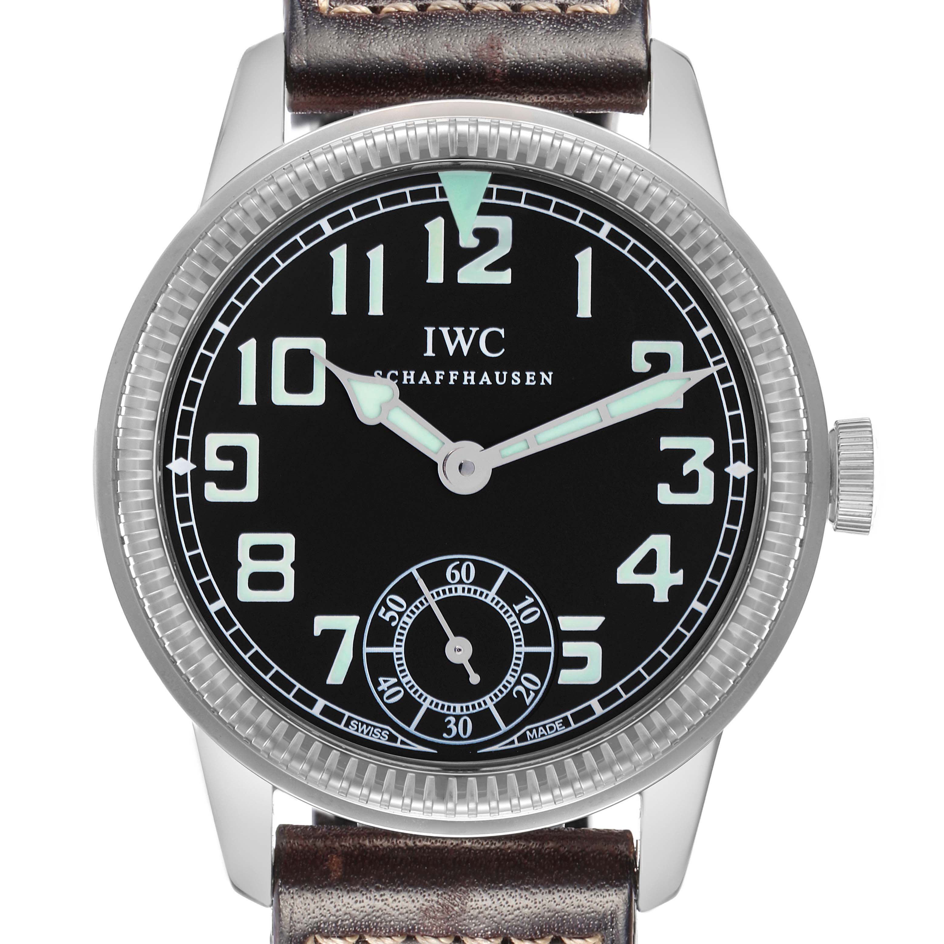 The IWC Pilot IW325401 Men
s Platinum Black Dial watch is shown from a front angle, displaying the face, bezel, and partial strap.