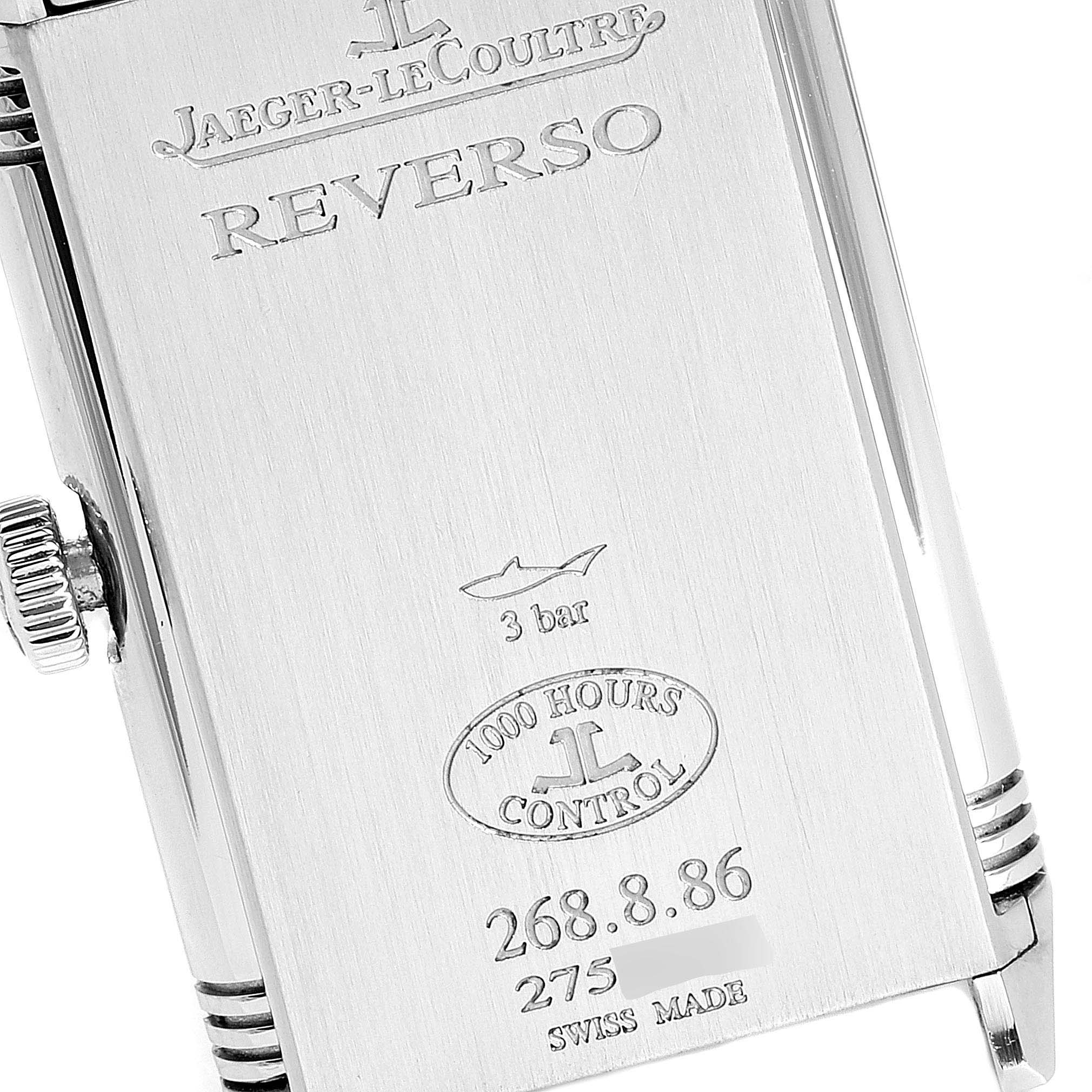 The image shows the engraved back of a Jaeger-LeCoultre Reverso watch case, including model numbers and water resistance rating.