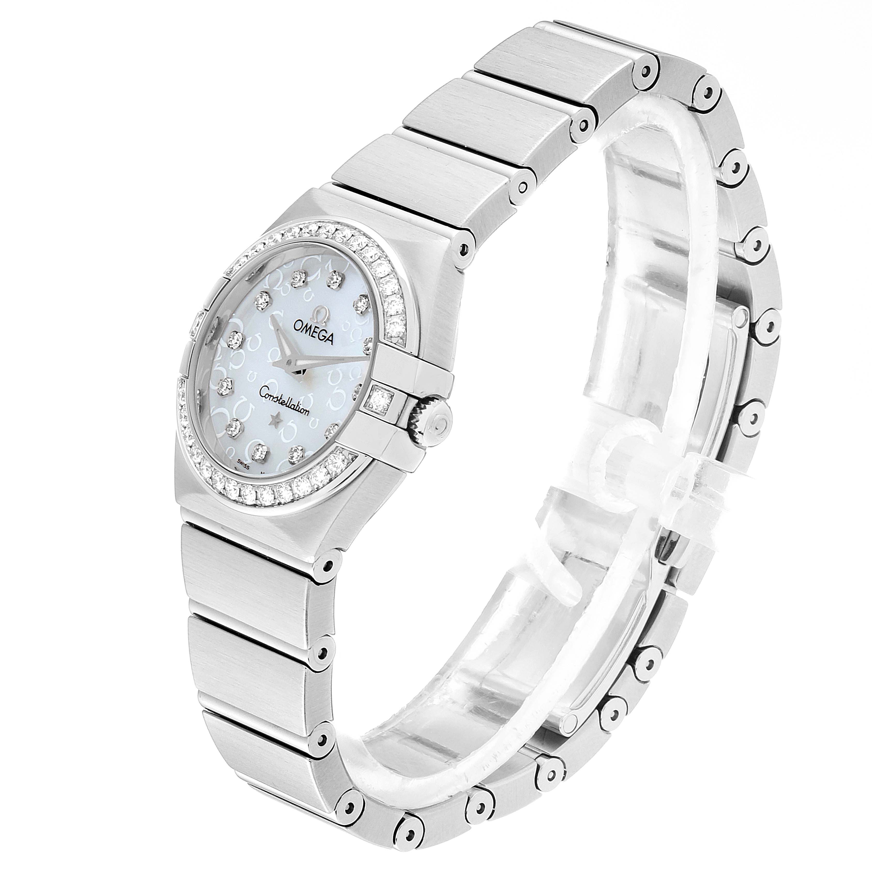 The image shows an angled side view of the Omega 123.15.24.60.52.001 Women's Stainless Steel Silver Dial 123.15.24.60.52.001 Women's Stainless Steel Silver Dial Constellation 27mm Diamond Ladies Watch 123.15.24.60.52.001, showcasing its face, bezel, and bracelet.