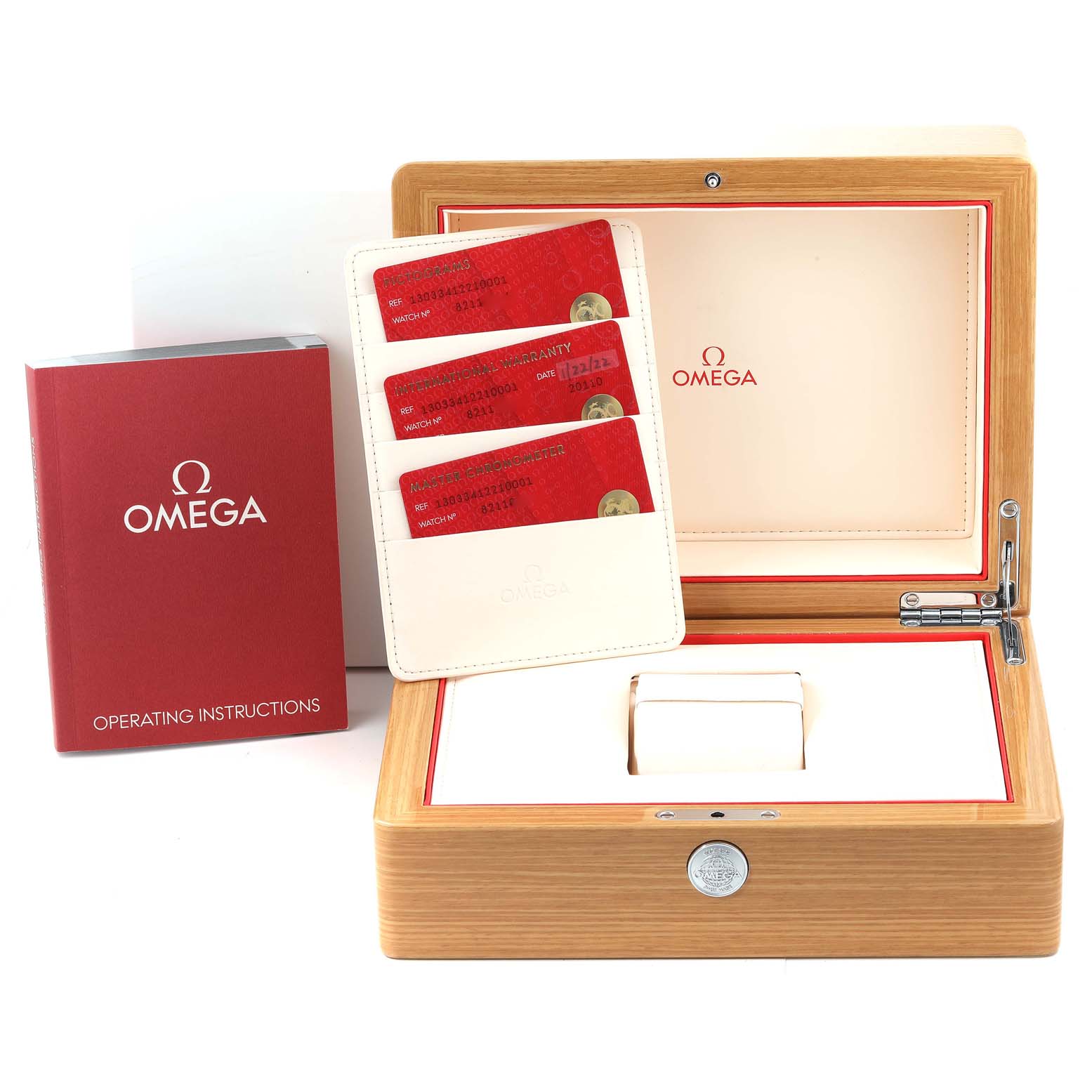 This image shows accessories for the Omega Constellation 130.33.41.22.10.001 Men's Stainless Steel Green Dial 130.33.41.22.10.001 Men's Stainless Steel Green Dial model, including the box, warranty cards, and an operating instructions booklet.