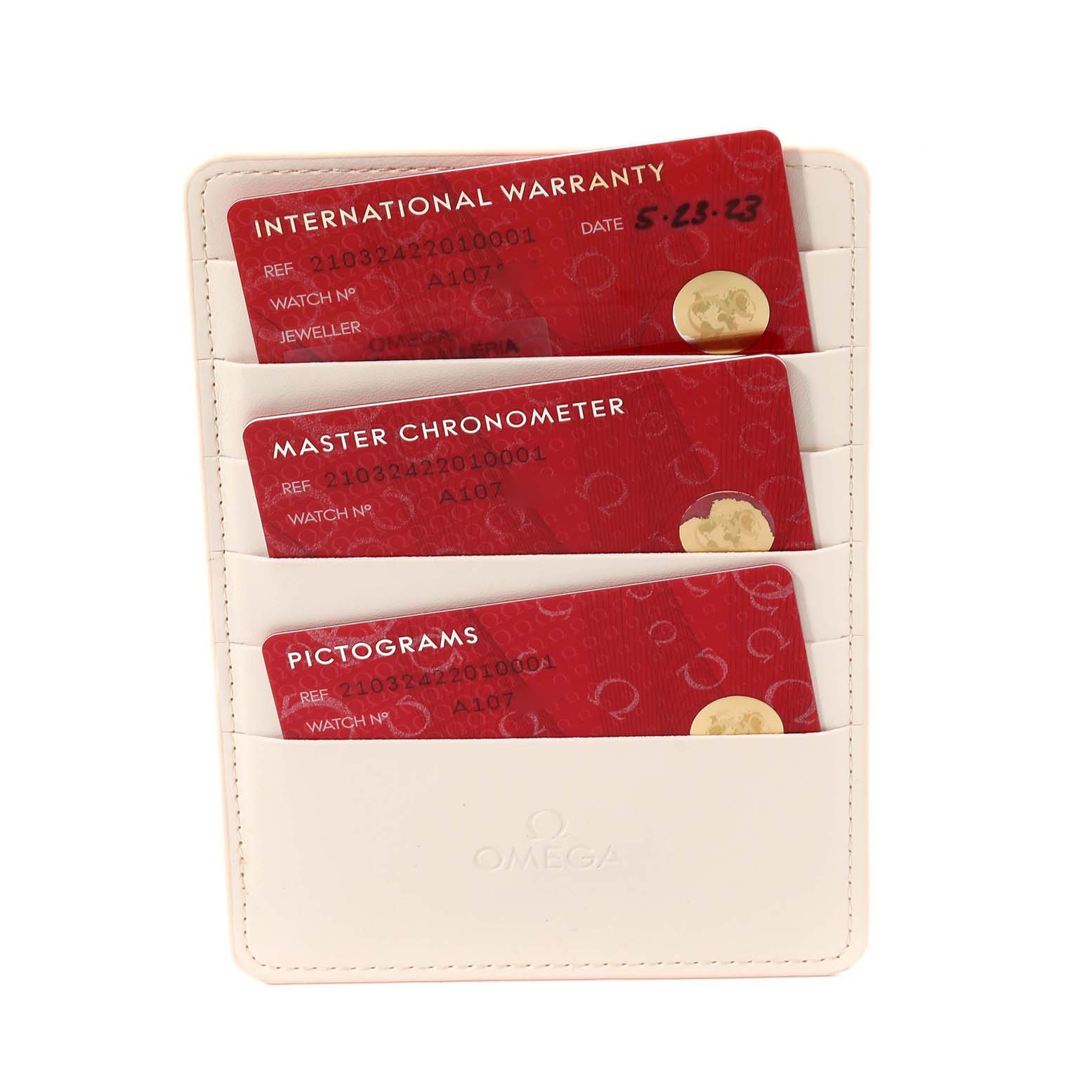 The image shows three Omega Seamaster 210.32.42.20.10.001 Men
s Stainless Steel Green Dial 210.32.42.20.10.001 Men
s Stainless Steel Green Dial model cards: International Warranty, Master Chronometer, and Pictograms in a cardholder.