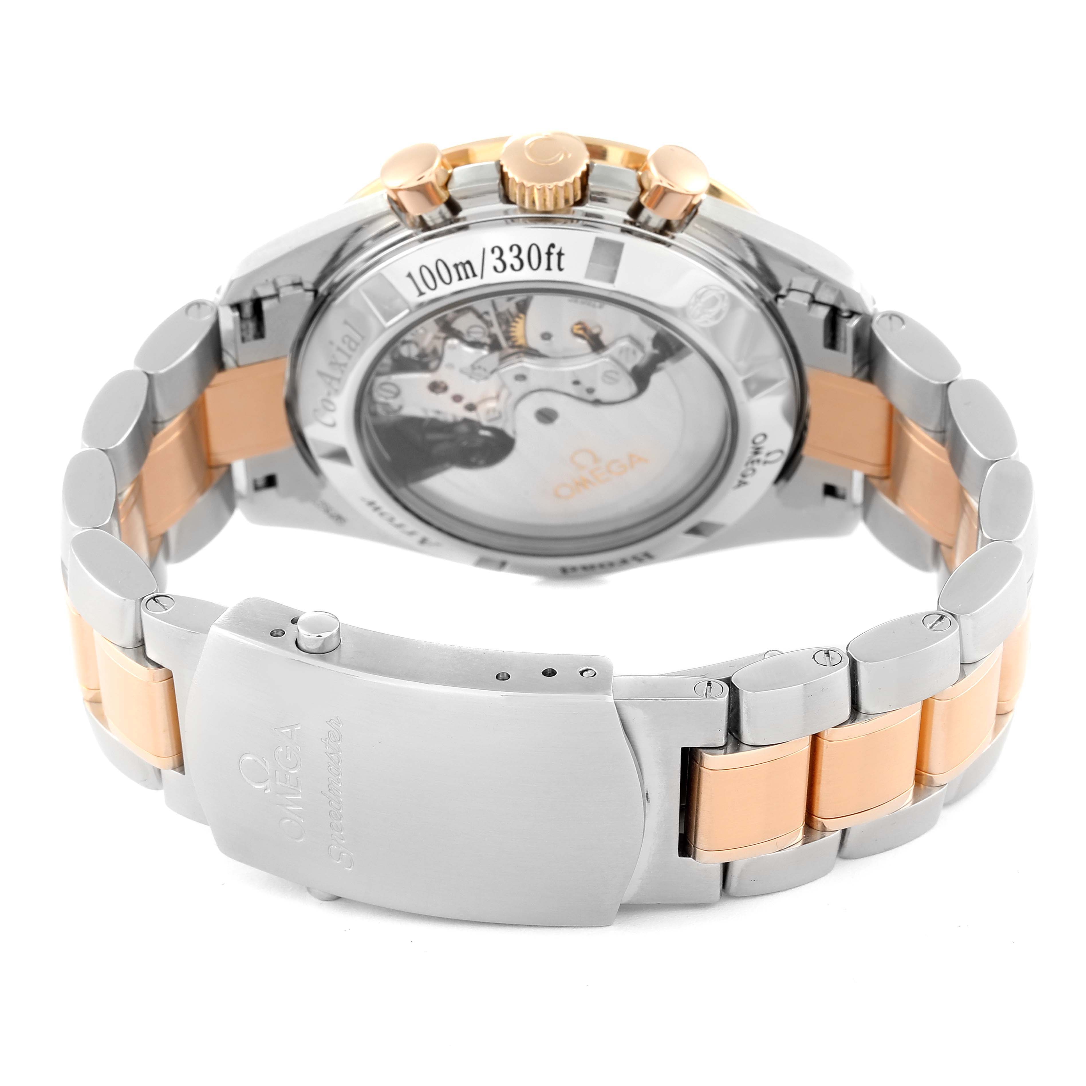 The image shows the back view of an Omega Speedmaster 321.90.42.50.13.001 Men's Steel and Gold (two tone) Brown Dial 321.90.42.50.13.001 Men's Steel and Gold (two tone) Brown Dial watch, highlighting its transparent case back and metal bracelet.