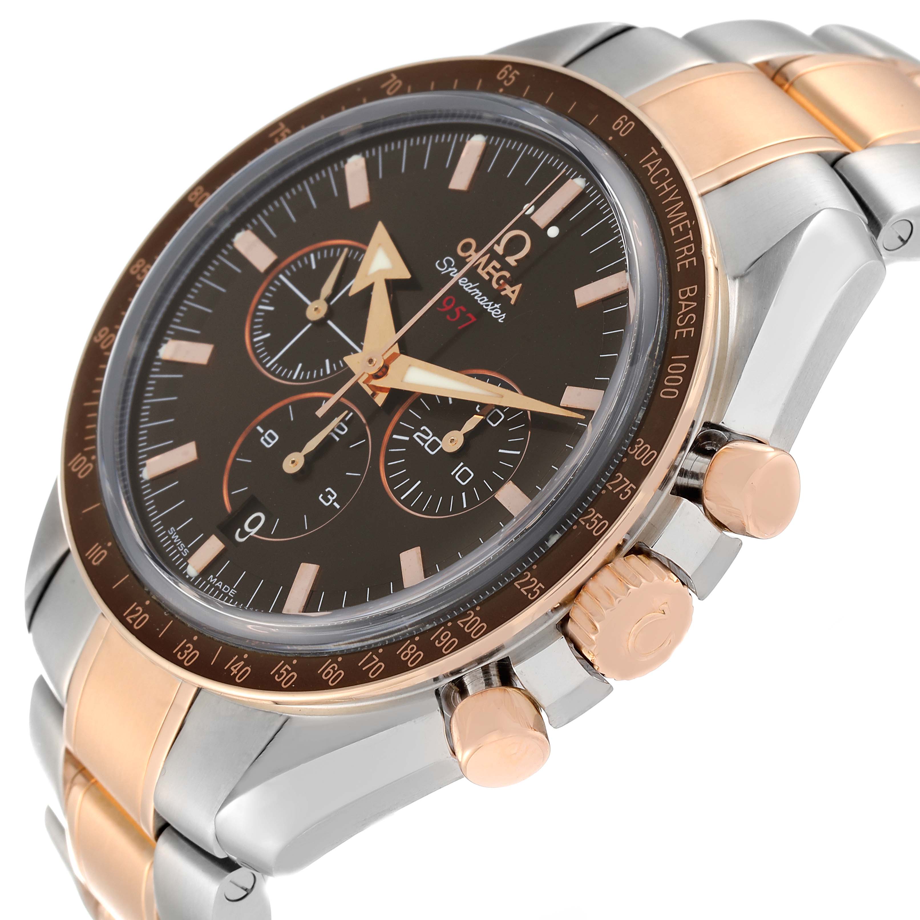 The Omega Speedmaster 321.90.42.50.13.001 Men's Steel and Gold (two tone) Brown Dial 321.90.42.50.13.001 Men's Steel and Gold (two tone) Brown Dial watch is shown at an angled close-up, revealing the dial, bezel, pushers, and part of the bracelet.