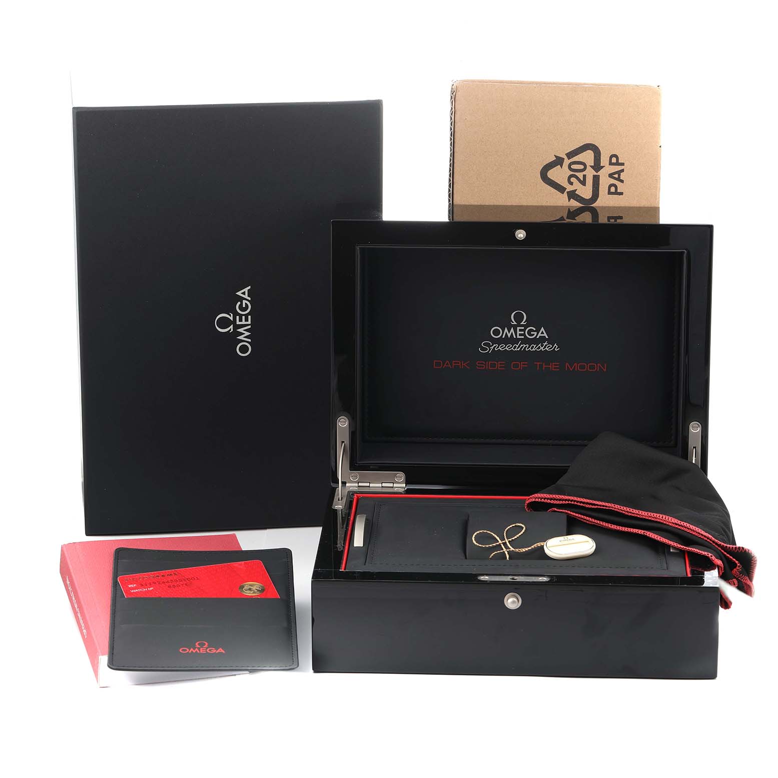 The image shows packaging for the Omega Speedmaster 311.92.44.30.01.001 Men
s Ceramic Black Dial, including the box, documentation, and accessories.