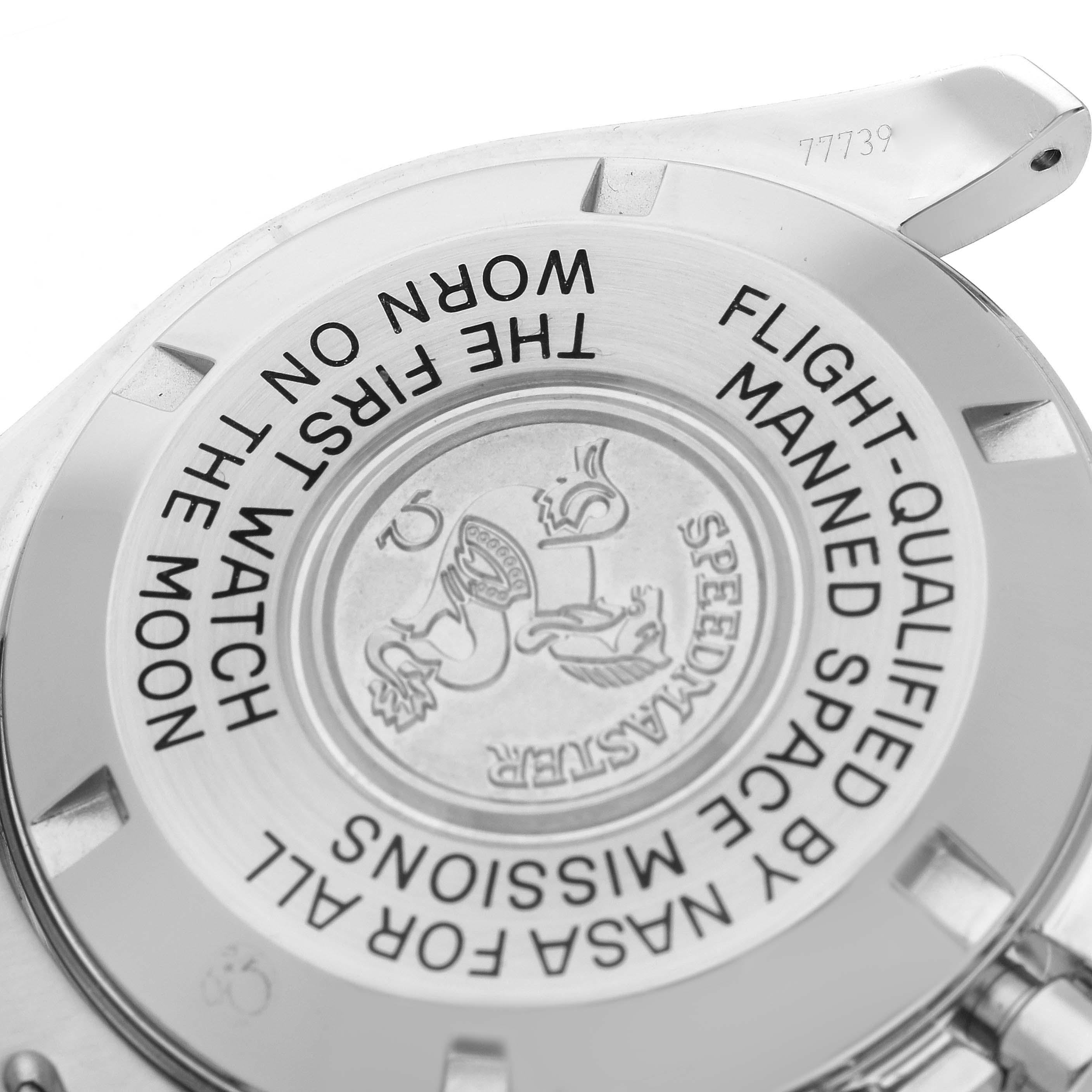 The image shows the back of an Omega Speedmaster 3570.50.00 Men
s Stainless Steel Black Dial watch, featuring the engraved case back with text and logo.