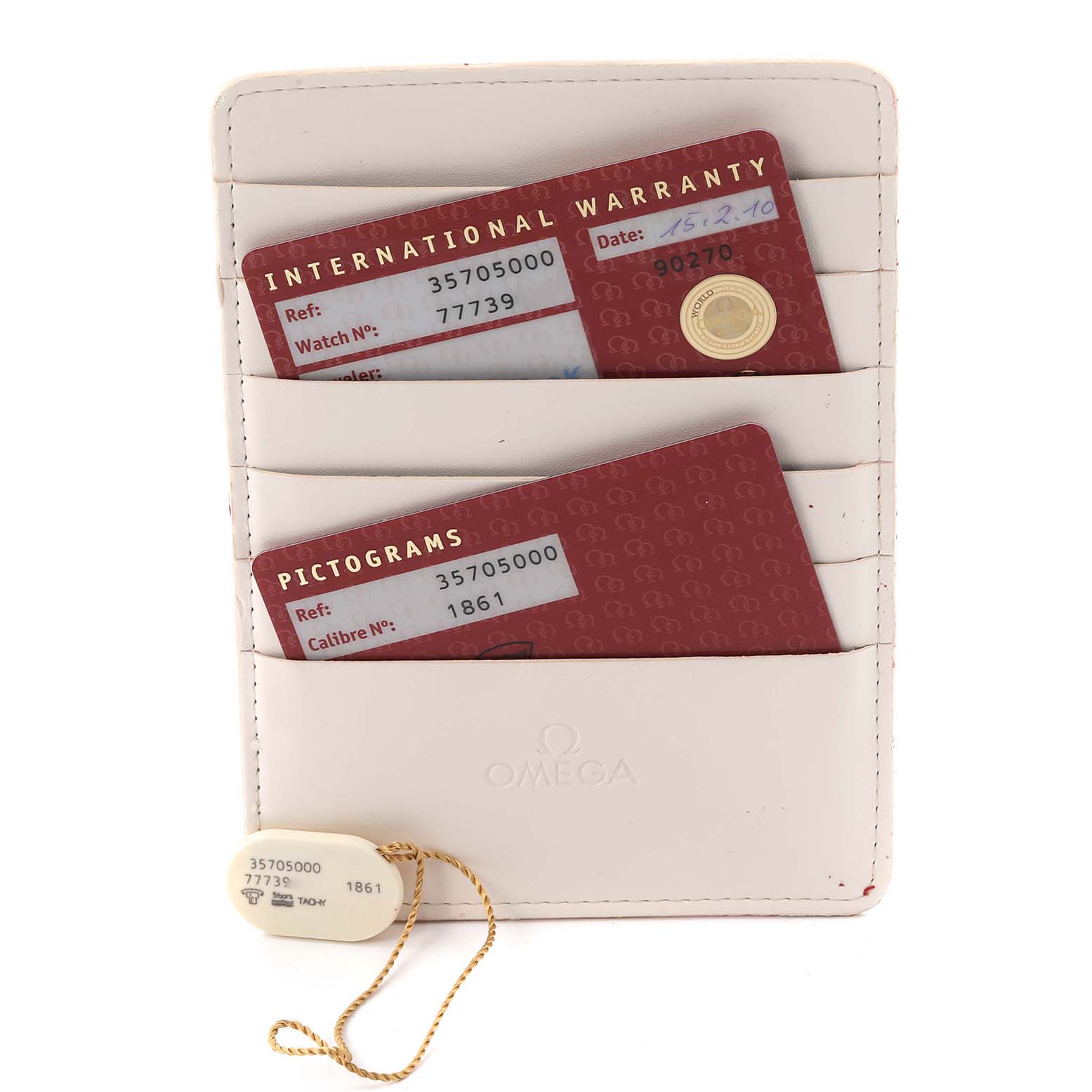 The image shows Omega Speedmaster 3570.50.00 Men
s Stainless Steel Black Dial model
s warranty cards and a tag, angled for a clear view of details.