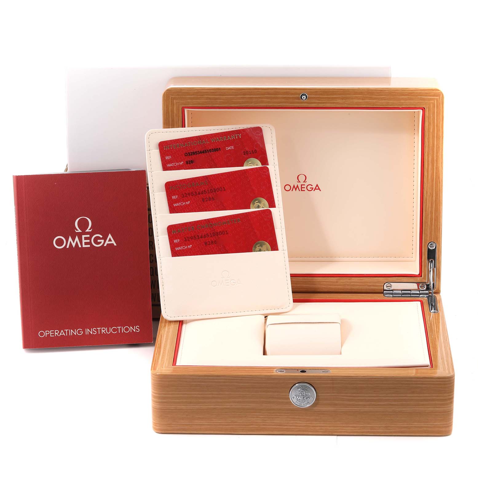 This image shows the watch box and accessories for the Omega Speedmaster 329.53.44.51.03.001 Men's Rose Gold Blue Dial 329.53.44.51.03.001 Men's Rose Gold Blue Dial model, including operating instructions and warranty cards.