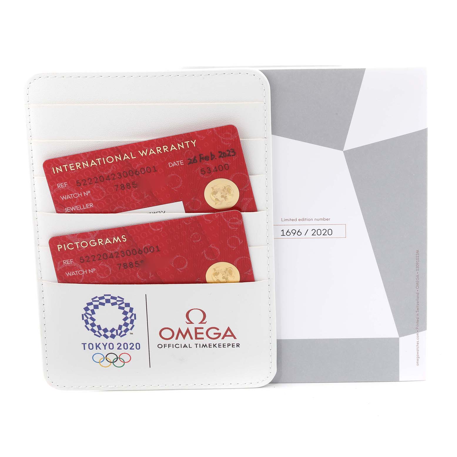 This image shows warranty and pictogram cards in a holder, along with a certificate for the Omega Speedmaster 522.20.42.30.06.001 Men's Stainless Steel Grey Dial 522.20.42.30.06.001 Men's Stainless Steel Grey Dial Tokyo 2020 edition.