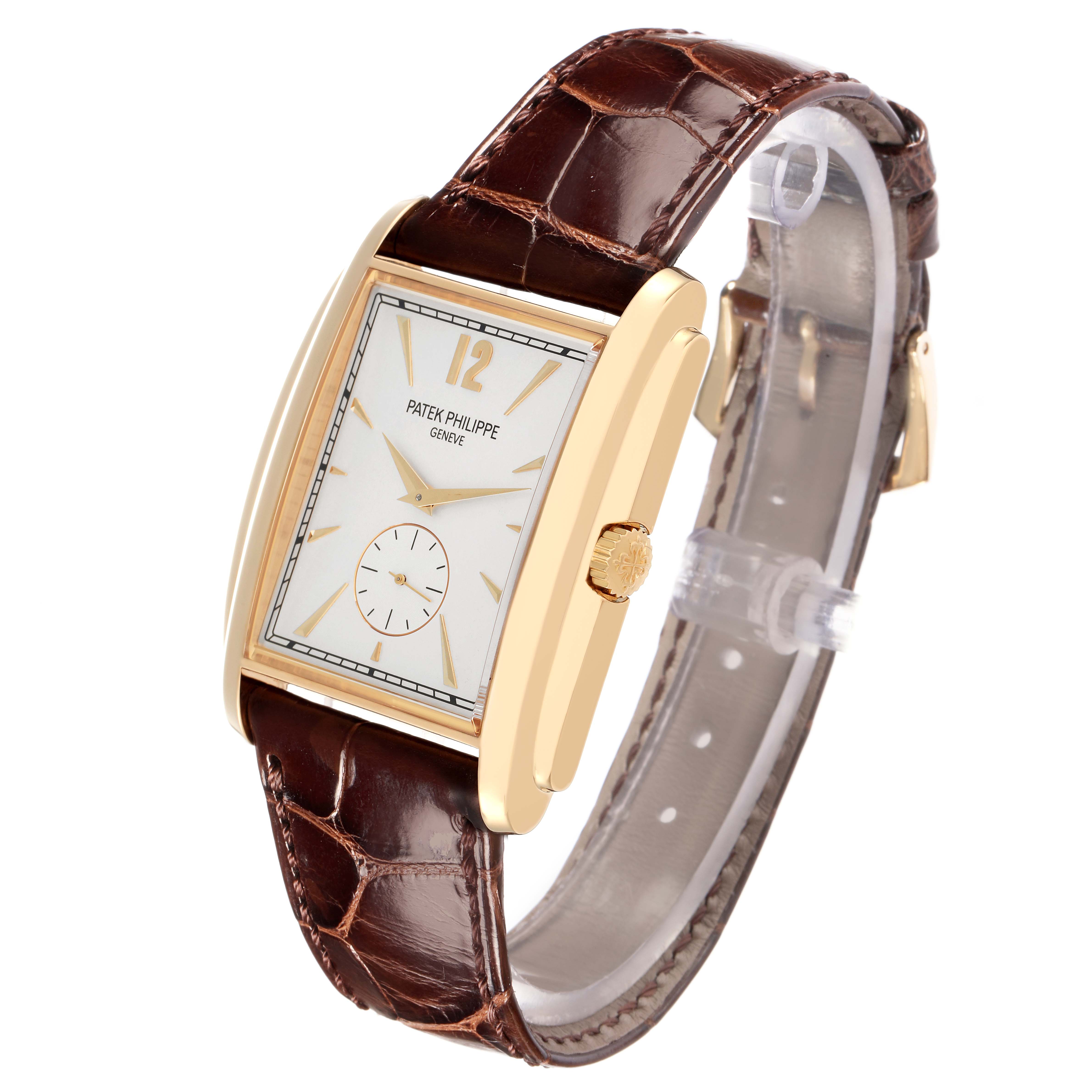 The Patek Philippe Gondolo 5124 Men
s Yellow Gold Silver Dial watch is shown from a 3/4 angle, displaying the face, gold case, crown, and leather strap.