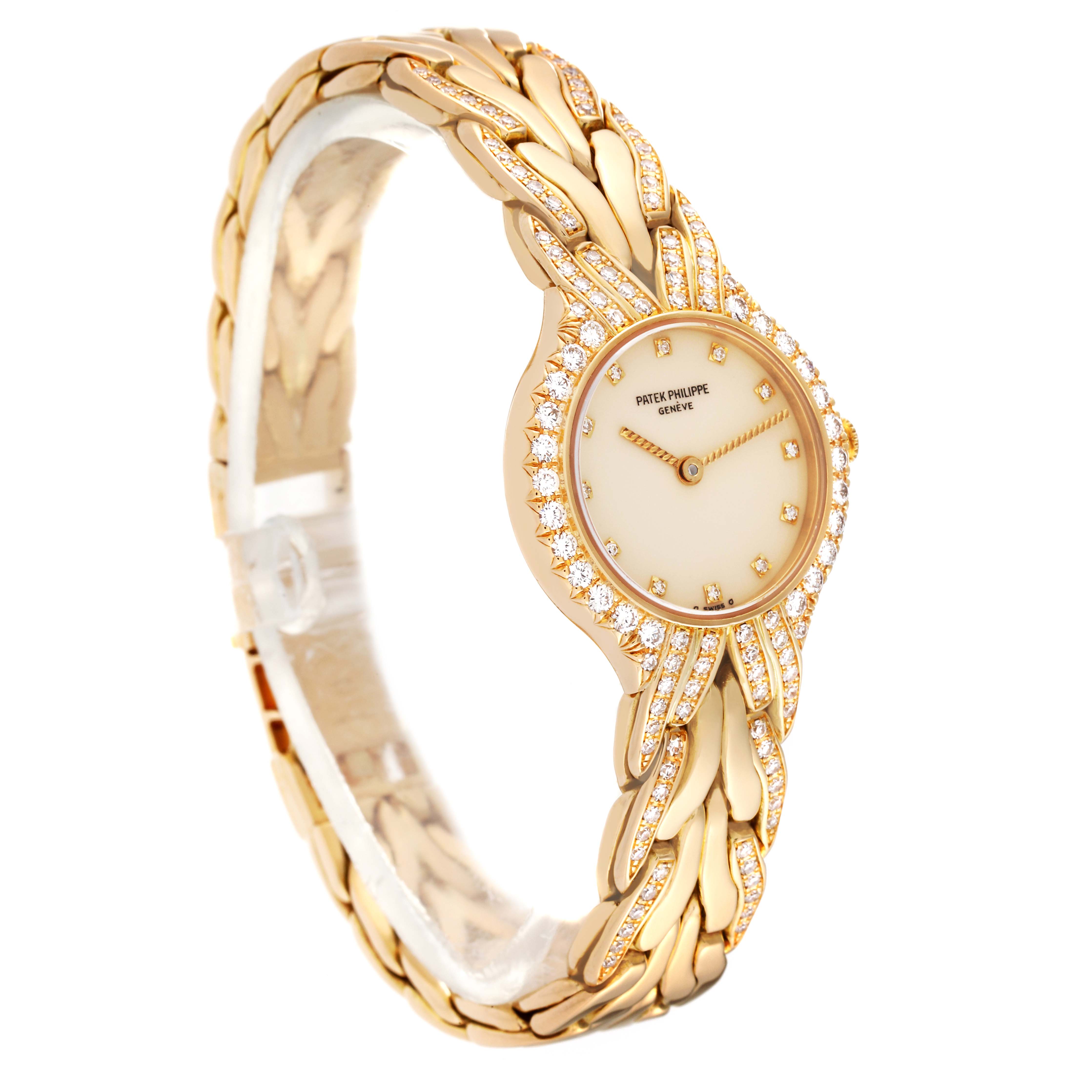 This image shows a side angle view of a gold Patek Philippe La Flamme  4816/3J Women's Yellow Gold Beige Dial 4816/3J Women's Yellow Gold Beige Dialwatch with a diamond bezel.