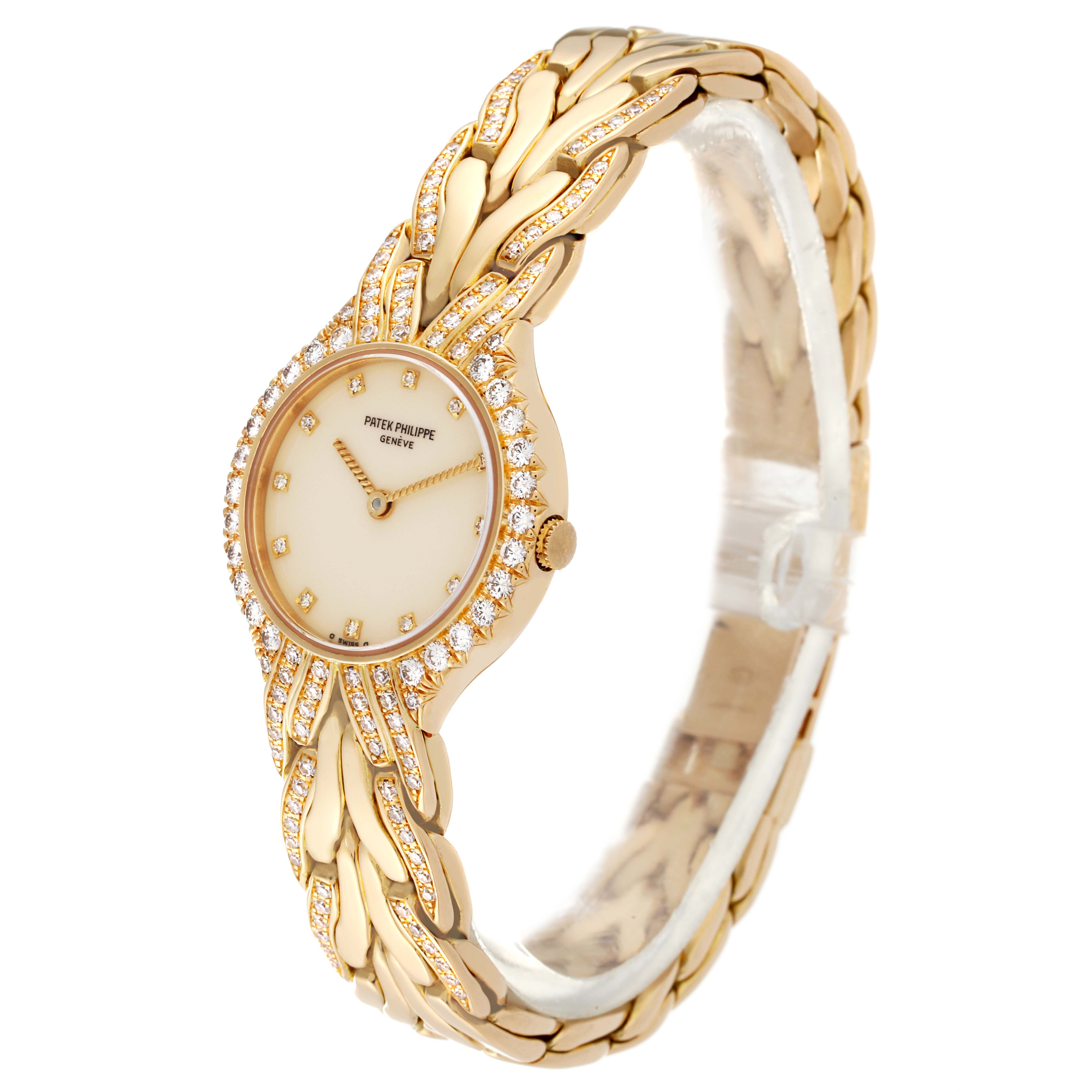 The image shows a Patek Philippe La Flamme  4816/3J Women's Yellow Gold Beige Dial 4816/3J Women's Yellow Gold Beige Dialwatch from an angled view, highlighting its face, golden strap, and diamond accents.