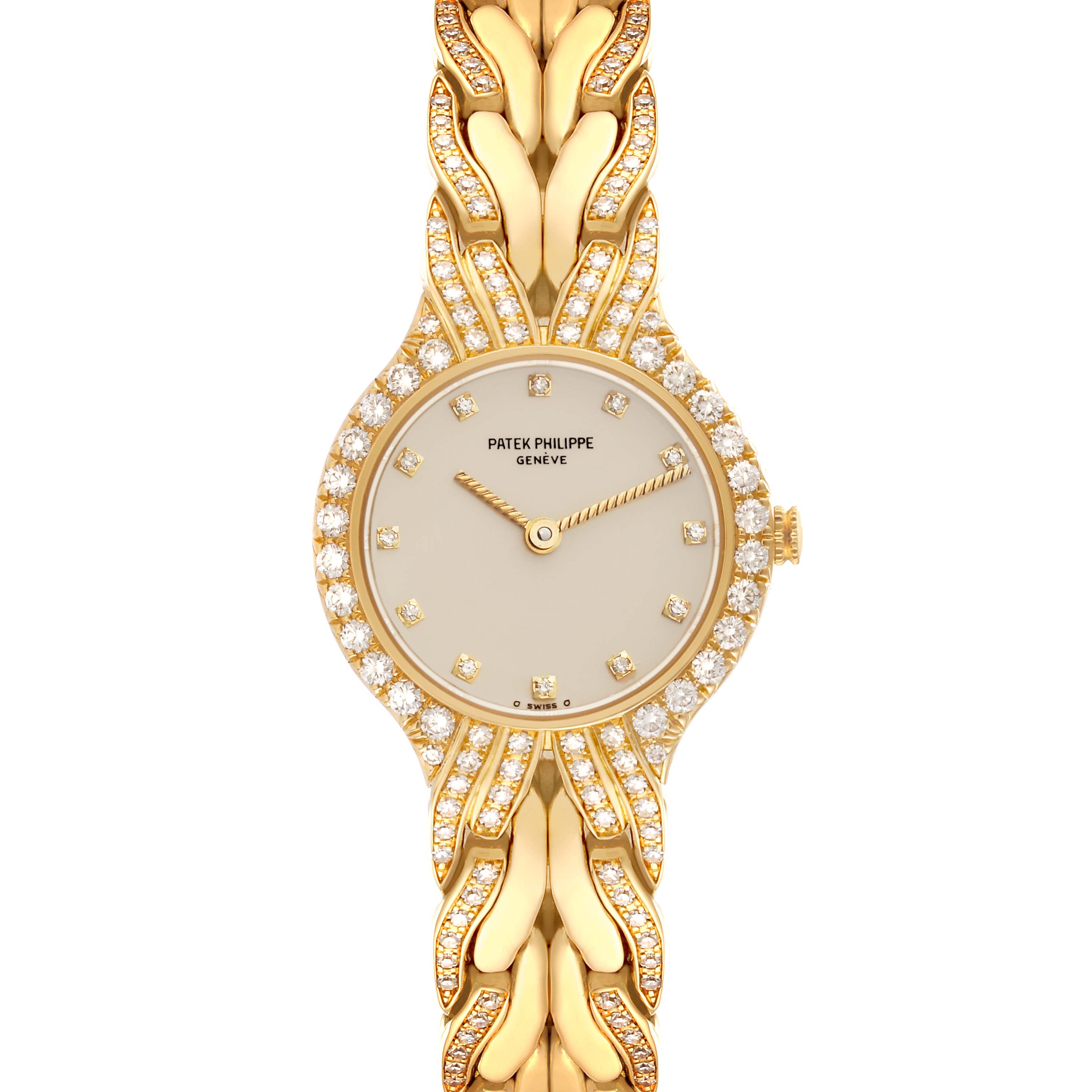 The Patek Philippe La Flamme  4816/3J Women's Yellow Gold Beige Dial 4816/3J Women's Yellow Gold Beige Dialmodel is shown from a top-down view, highlighting its gold bracelet, diamond-encrusted bezel, and minimalist dial.