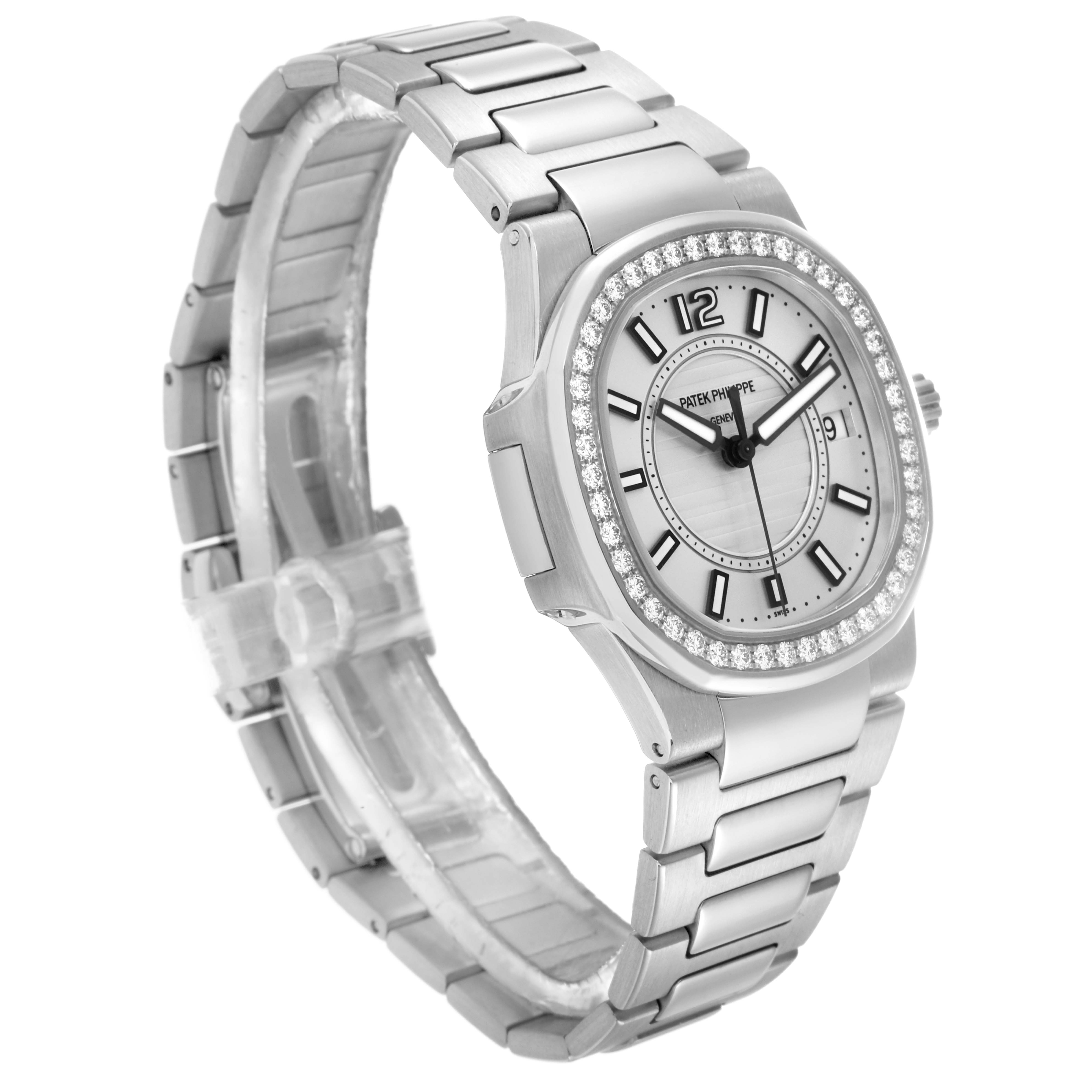 The Patek Philippe Nautilus 7010 Women
s White Gold Silver Dial watch is shown at a three-quarter angle, displaying the face, bezel, and bracelet.