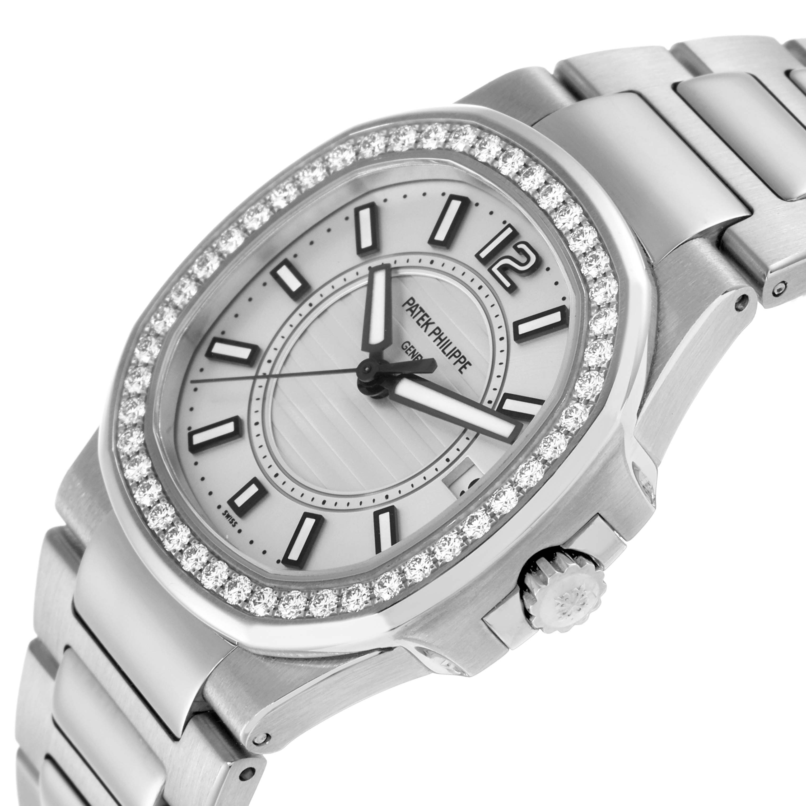 The Patek Philippe Nautilus 7010 Women
s White Gold Silver Dial watch is shown at an angle displaying the face, diamond bezel, crown, and part of the bracelet.