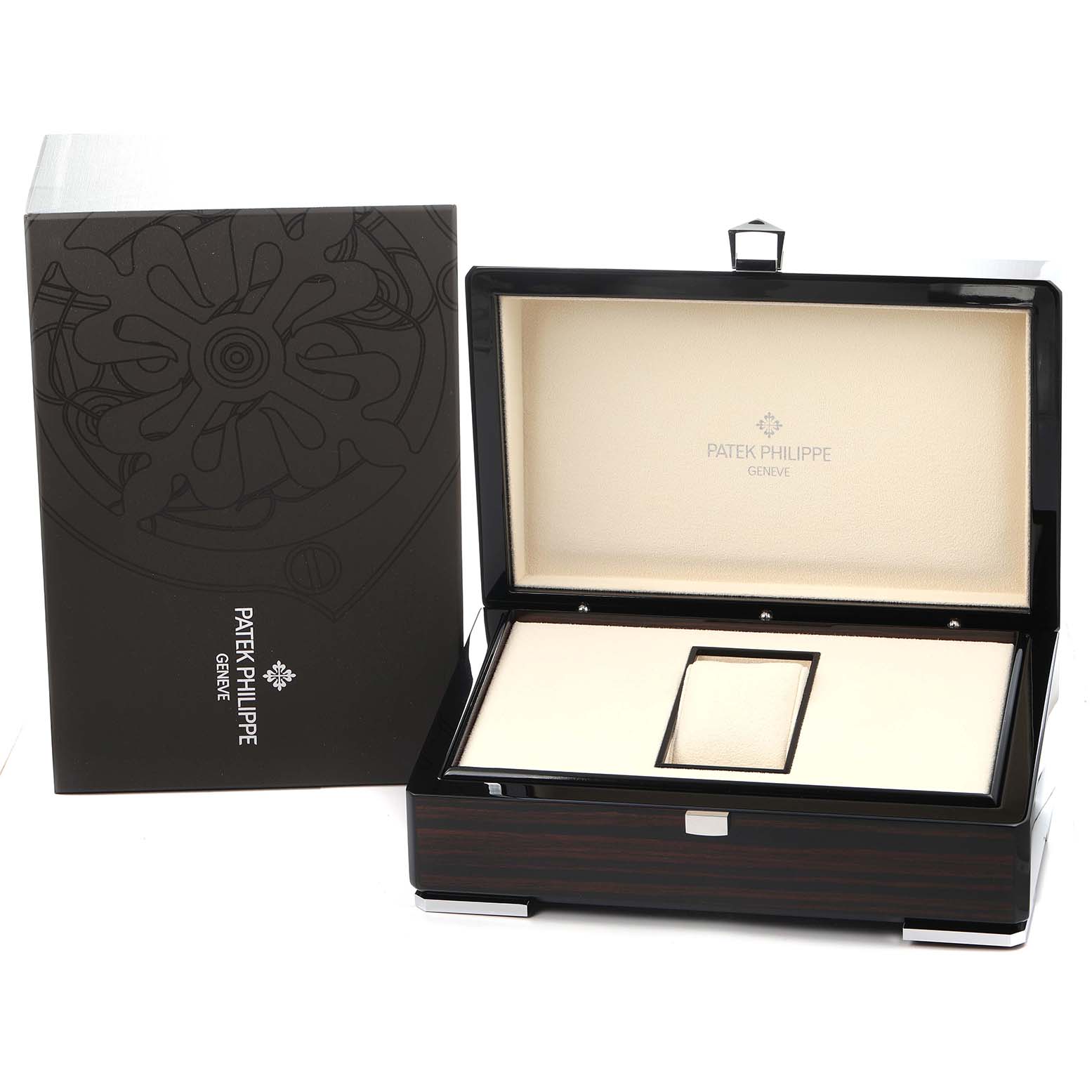 The image shows an open Patek Philippe Nautilus 7010 Women
s White Gold Silver Dial watch box and packaging with the brand
s logo inside the lid.