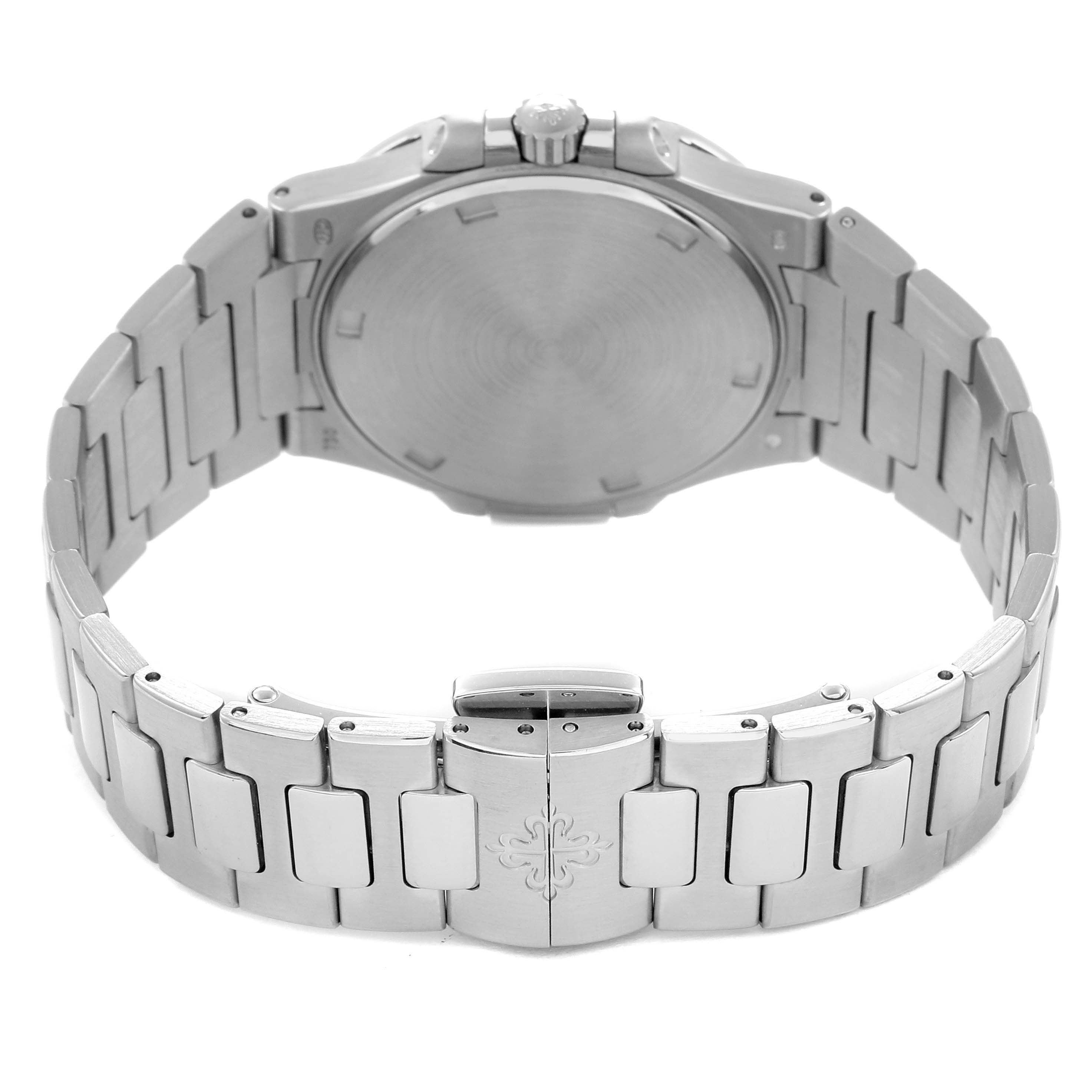 The Patek Philippe Nautilus 7010 Women
s White Gold Silver Dial watch is shown from the back, featuring its case back, crown, and bracelet clasp.