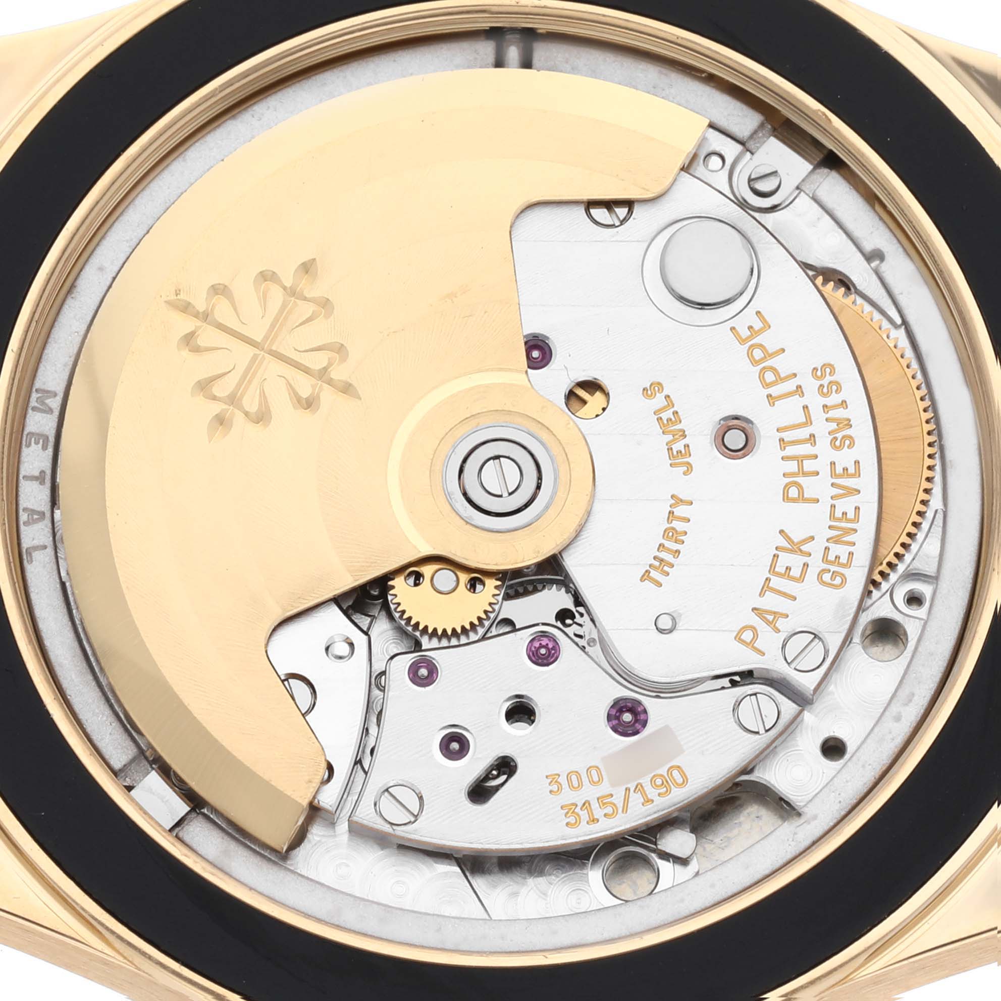 The image shows the back of the Patek Philippe Neptune 5081/1J-001 Men's Yellow Gold Silver Dial 5081/1J-001 Men's Yellow Gold Silver Dial model, highlighting its intricate movement and mechanism.