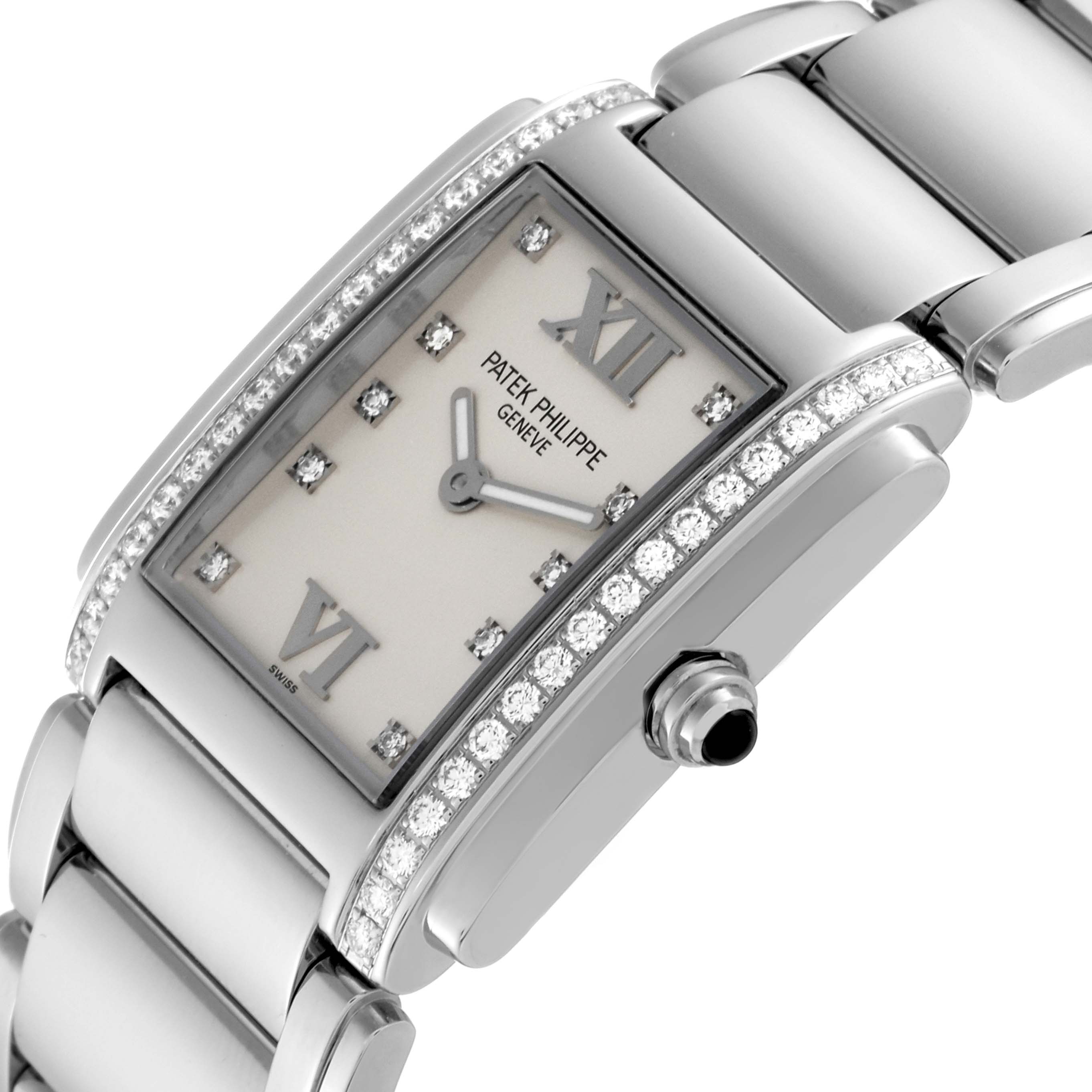 This image shows a close-up angle of the Patek Philippe Twenty-4 4910/10A-011 Women's Stainless Steel Silver Dial 4910/10A-011 Women's Stainless Steel Silver Dial watch, highlighting the dial, bezel with diamonds, and part of the bracelet.