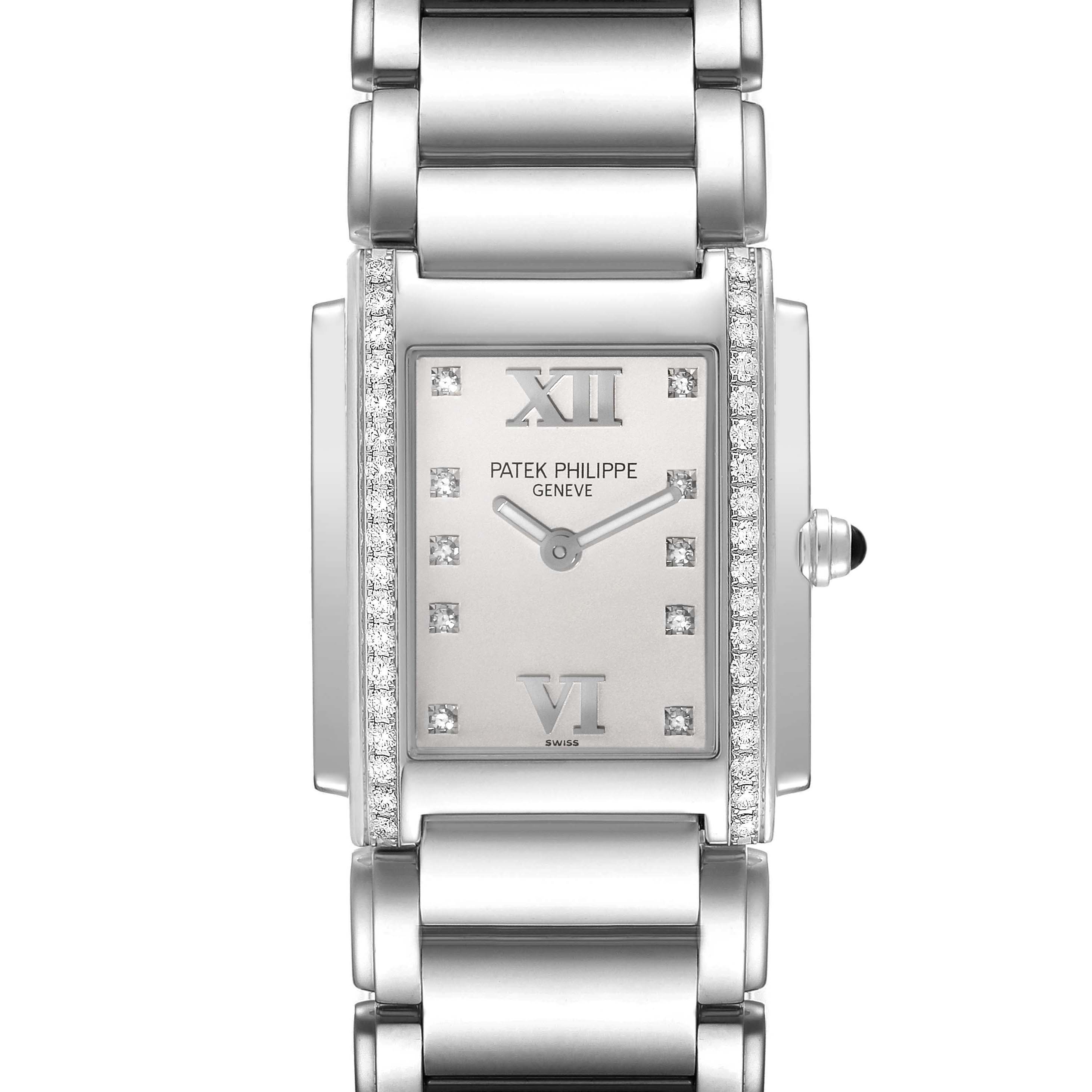 The image shows a frontal view of the Patek Philippe Twenty-4 4910/10A-011 Women's Stainless Steel Silver Dial 4910/10A-011 Women's Stainless Steel Silver Dial watch, featuring its rectangular dial, diamond accents, and metal bracelet.