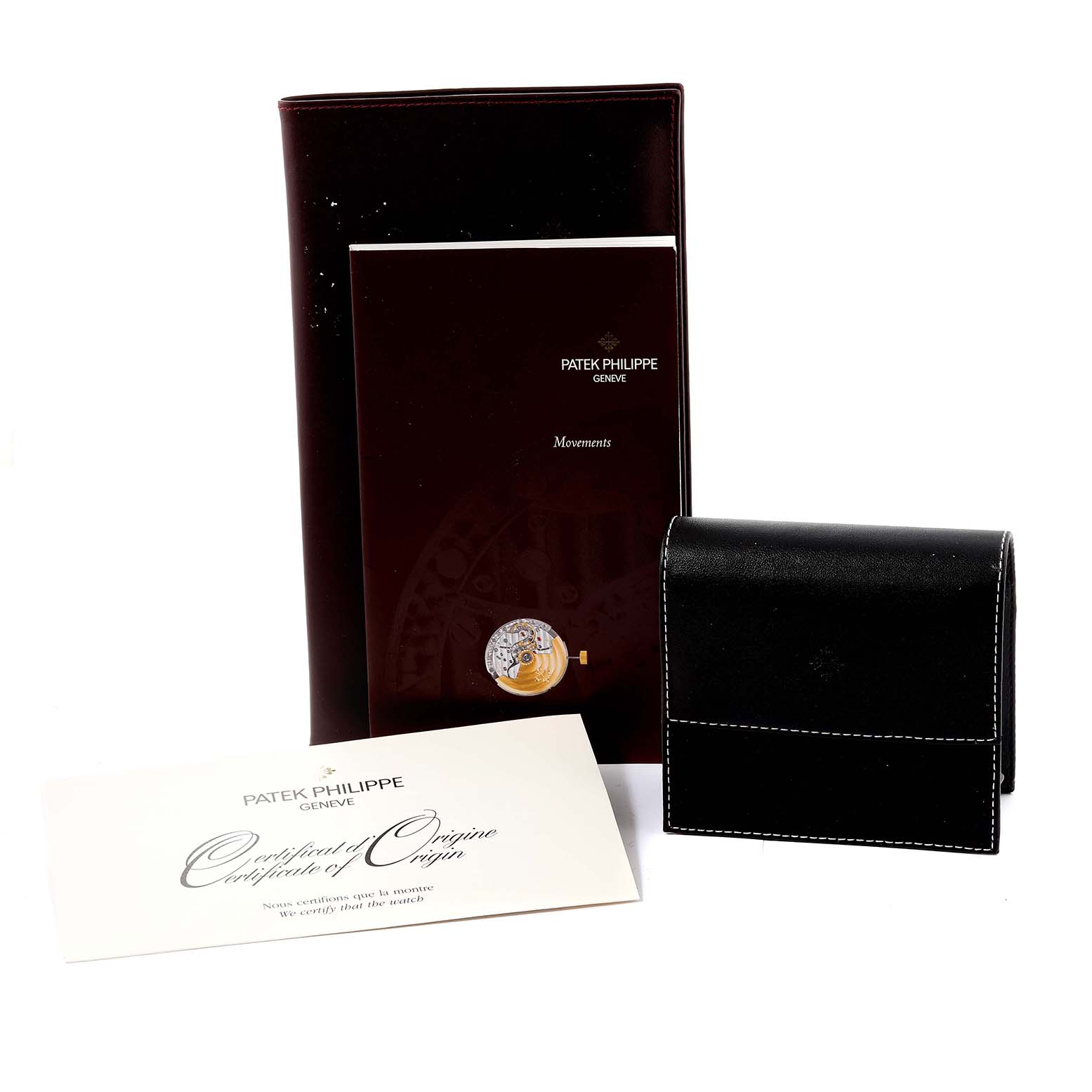 This image shows the paperwork, documentation, and a leather case for the Patek Philippe Twenty-4 4910/10A-011 Women's Stainless Steel Silver Dial 4910/10A-011 Women's Stainless Steel Silver Dial watch model.