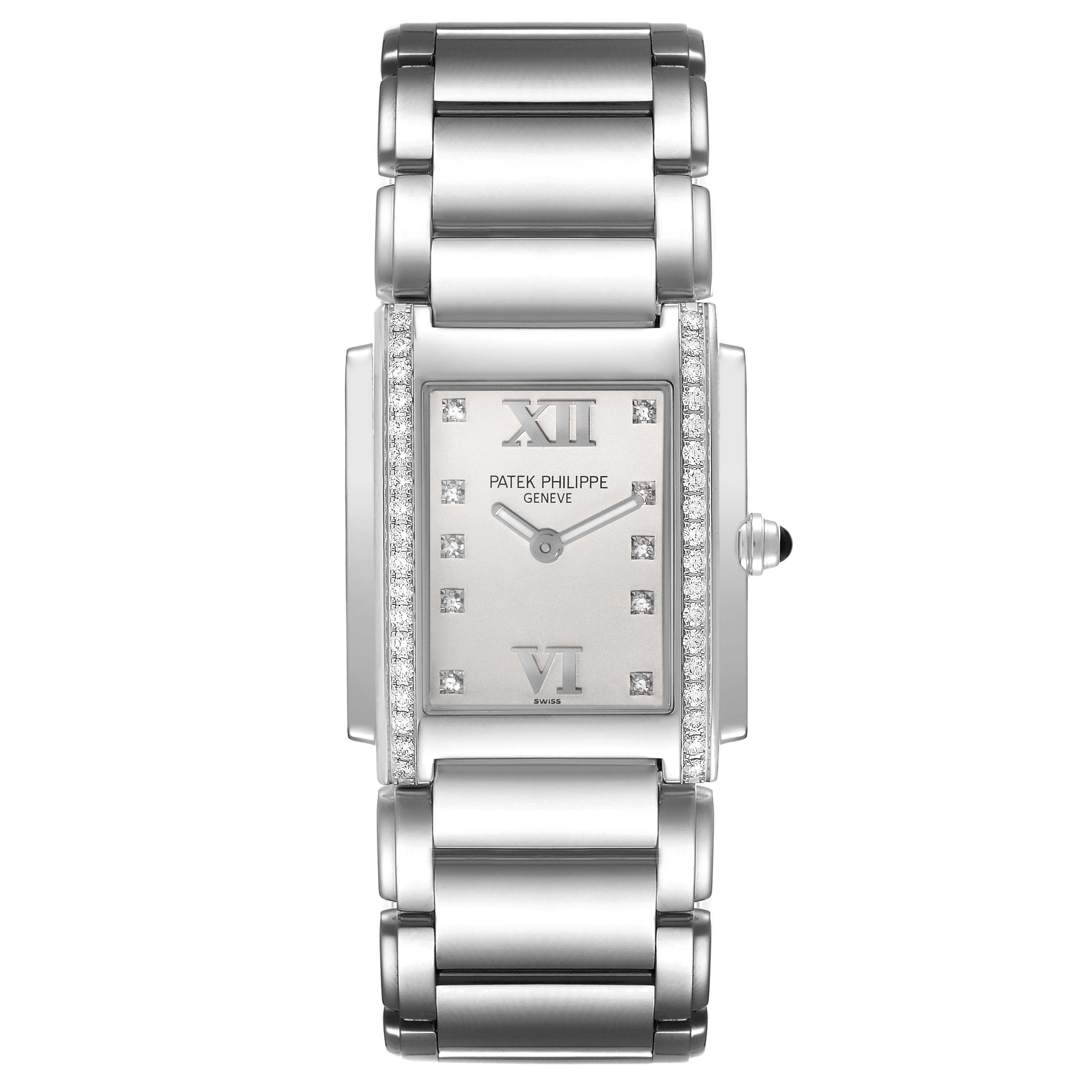 The Patek Philippe Twenty-4 4910/10A-011 Women's Stainless Steel Silver Dial 4910/10A-011 Women's Stainless Steel Silver Dial watch is shown from a top-down angle, displaying its full bracelet, rectangular case, and dial.