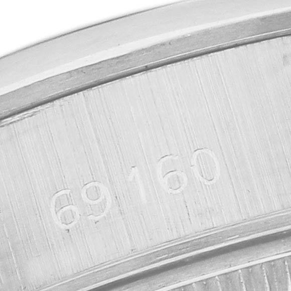 This image shows a close-up of the case back
s inner engraving of a Rolex Date 69160 Women
s Stainless Steel Blue Dial model, displaying the model number "69160."