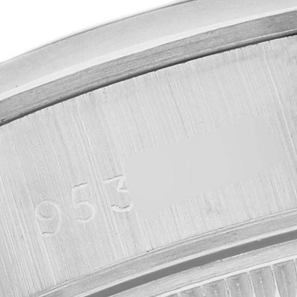The image shows a close-up of the serial number engraving on the case of a Rolex Date 69160 Women
s Stainless Steel Blue Dial watch.