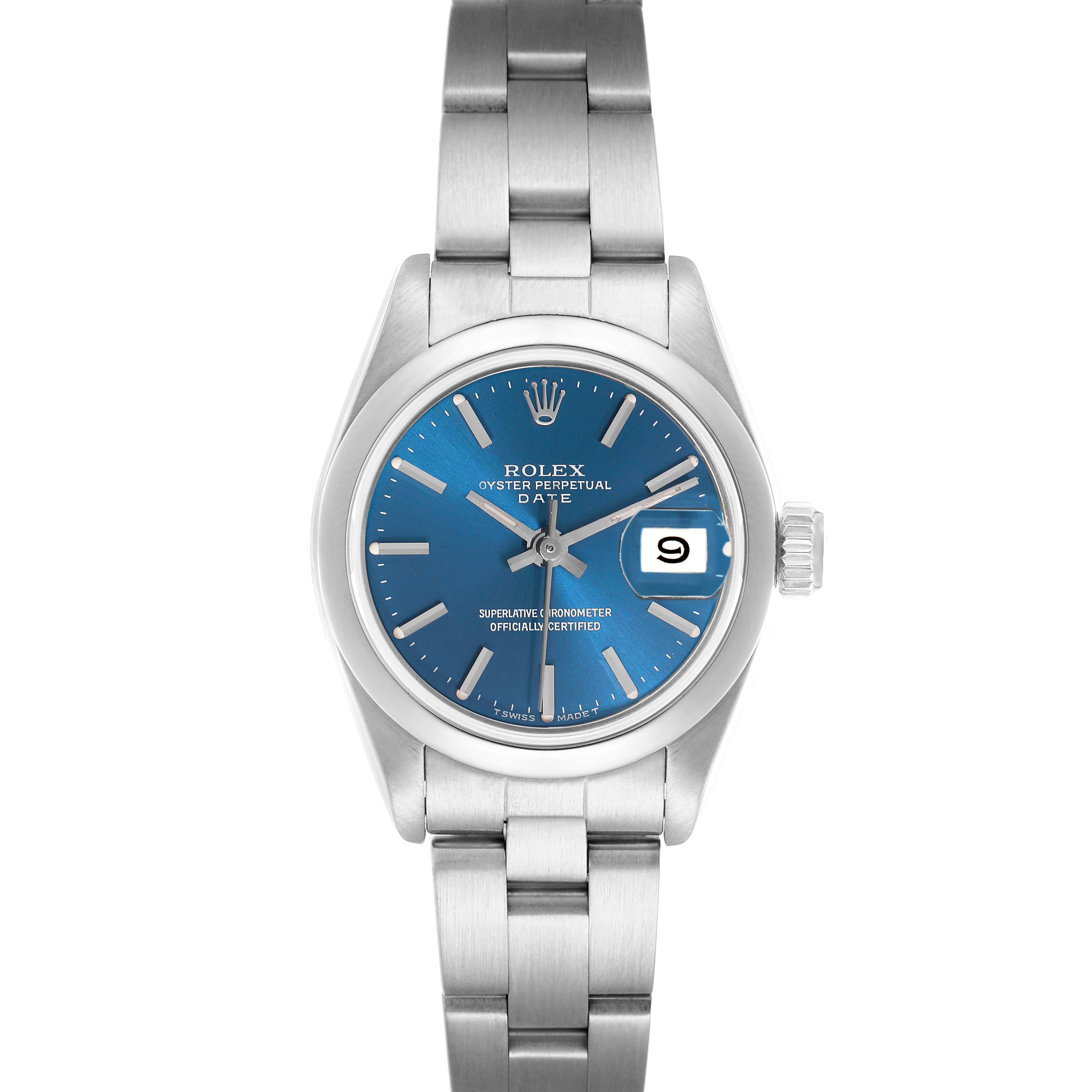 The Rolex Date 69160 Women
s Stainless Steel Blue Dial watch is shown from a top-down angle, displaying its blue dial and metal bracelet.