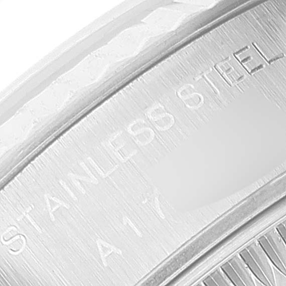 This image shows a close-up of the stainless steel casing with the engraving on a Rolex Datejust 79174 Women's Stainless Steel Silver Dial 79174 Women's Stainless Steel Silver Dial model watch.