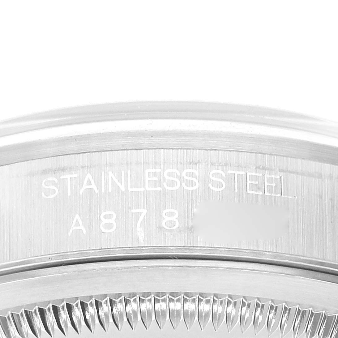 The image shows a close-up of the side of a Rolex Datejust 16200 Men's Stainless Steel Silver Dial 16200 Men's Stainless Steel Silver Dial, highlighting the engraved serial number and "STAINLESS STEEL" text.