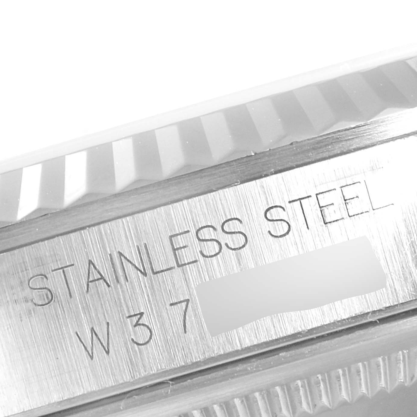 The image shows a close-up view of the engraved stainless steel casing on a Rolex Datejust 16234 Men's Stainless Steel Black Dial 16234 Men's Stainless Steel Black Dial watch.