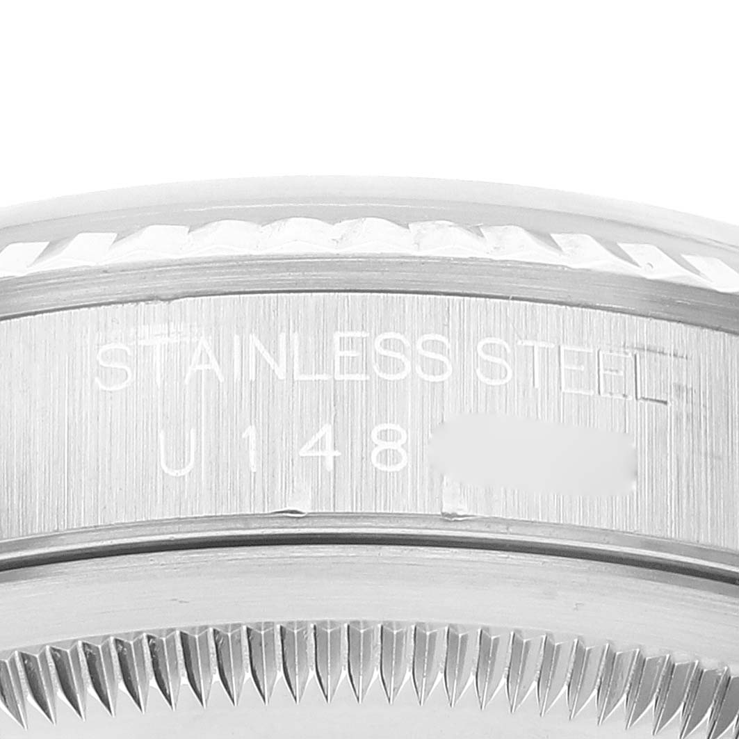 This image shows the side profile of the stainless steel case and the fluted bezel of a Rolex Datejust 16234 Men's Stainless Steel Blue Dial 16234 Men's Stainless Steel Blue Dial watch.